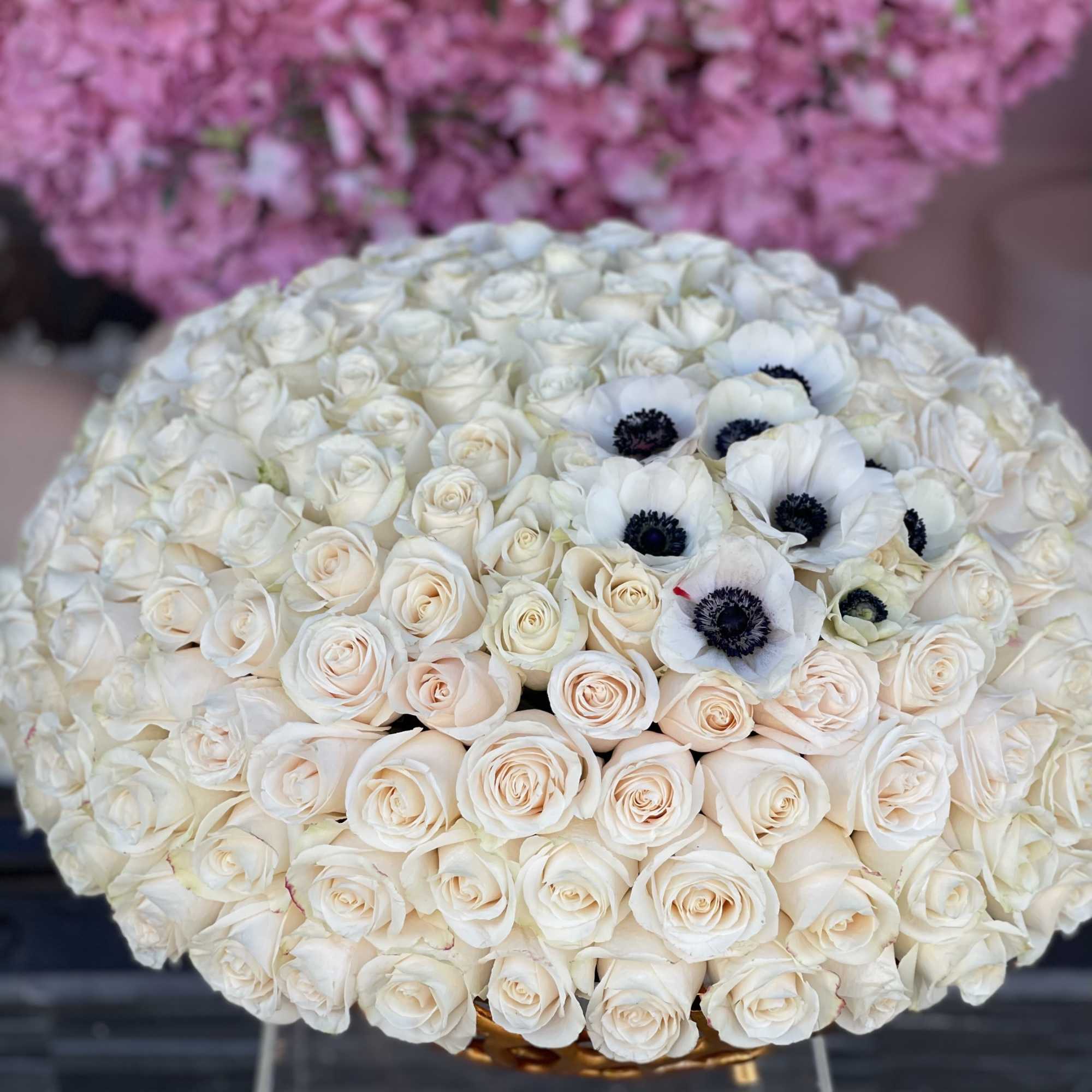 Large bouquet of white roses with a few white anemones