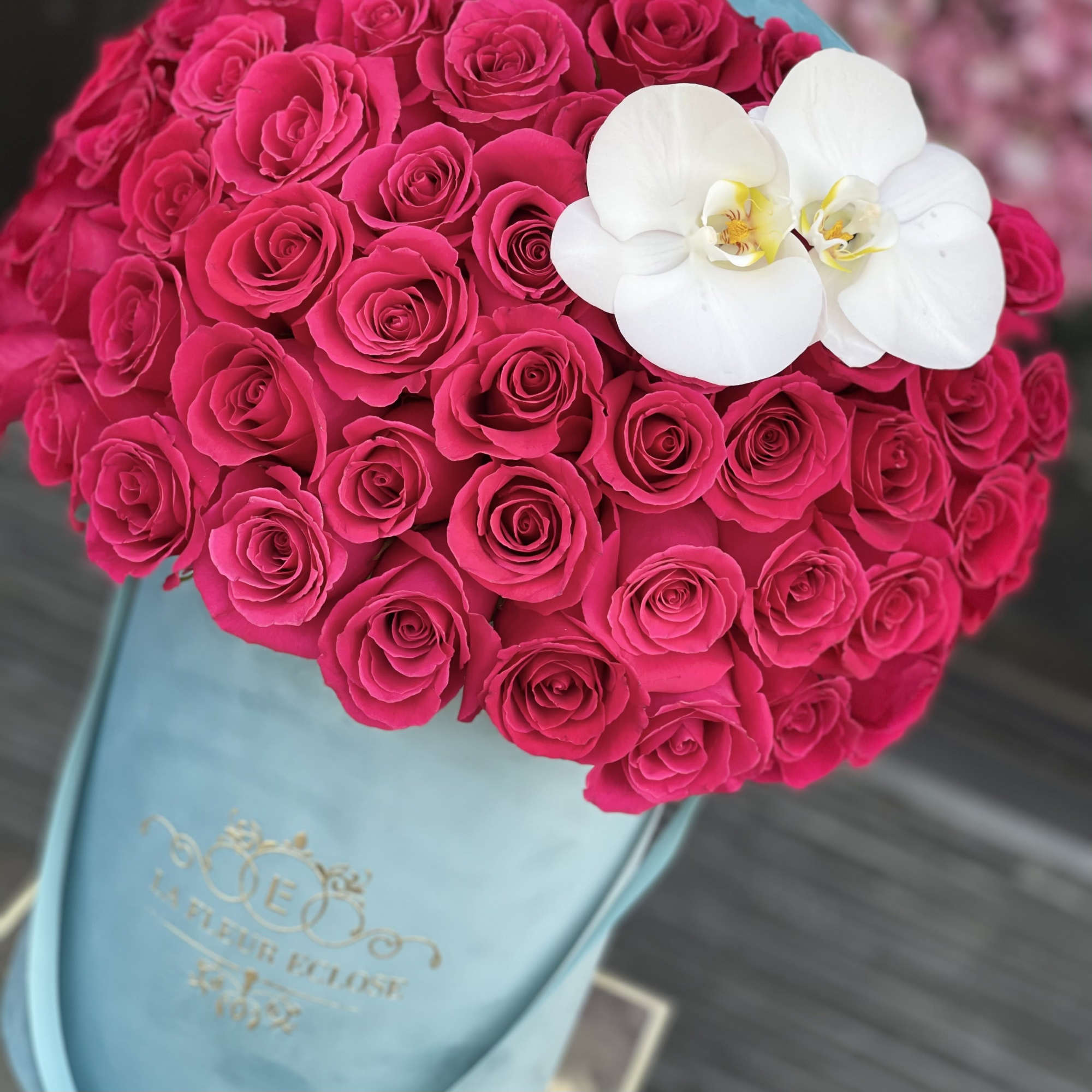 Standard 50 hot pink roses in our signature turquoise box
Deluxe 75 hot, photo 2 of 2