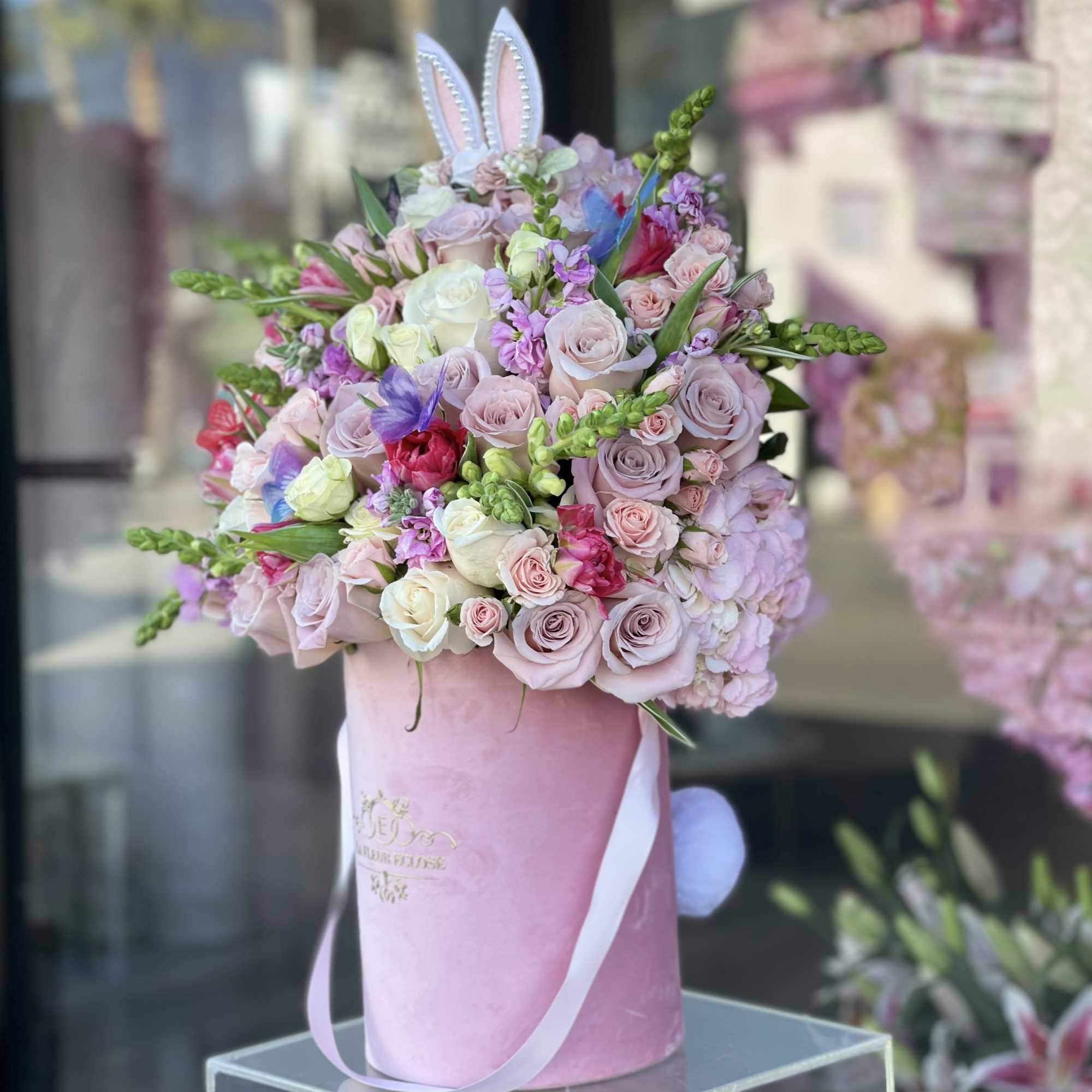 Bunny and butterflies in a pink velvet box with fresh flowers

Bunny ears, photo 2 of 2