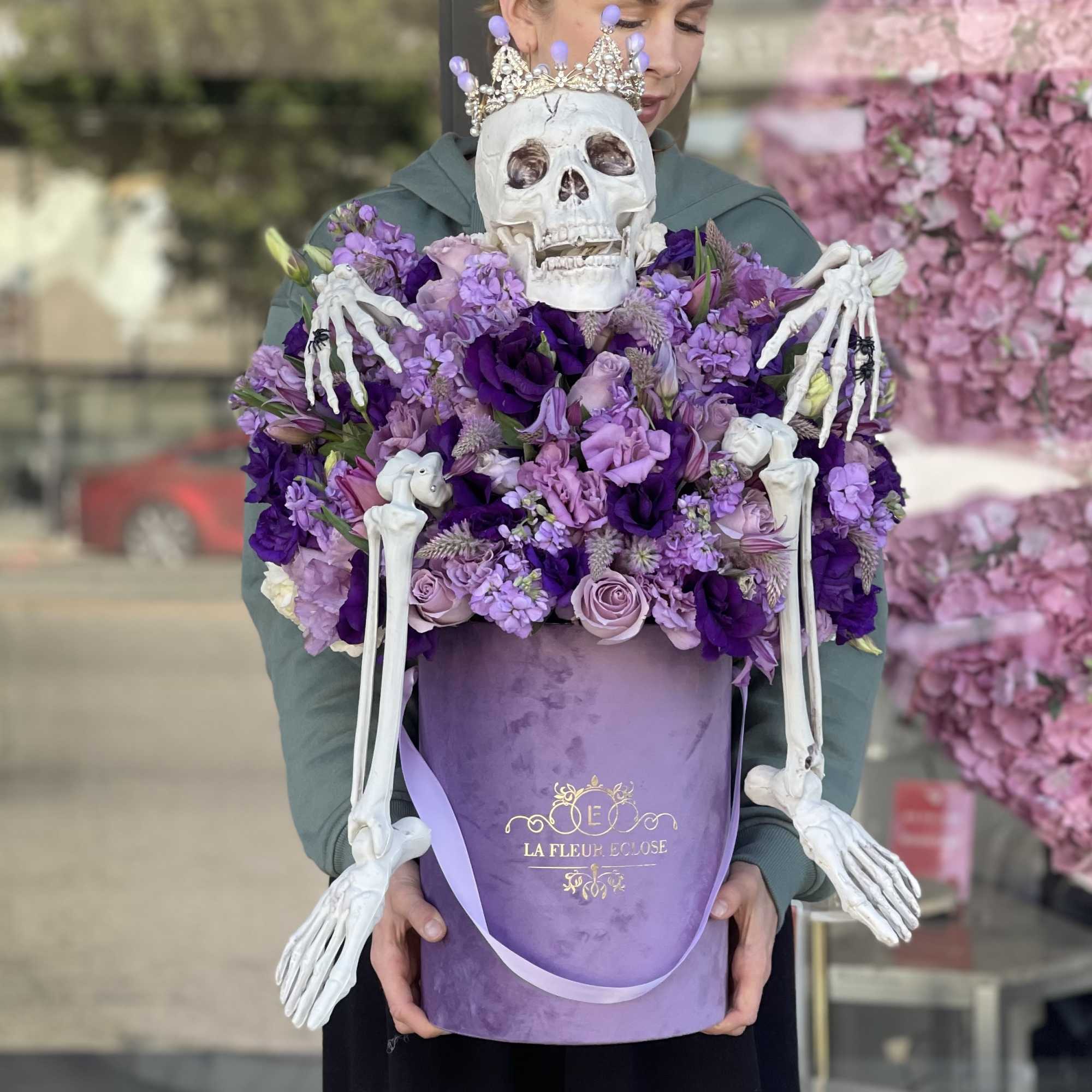 Arrangement of fresh purple and lavender flowers with our scary skeleton with, photo 3 of 3