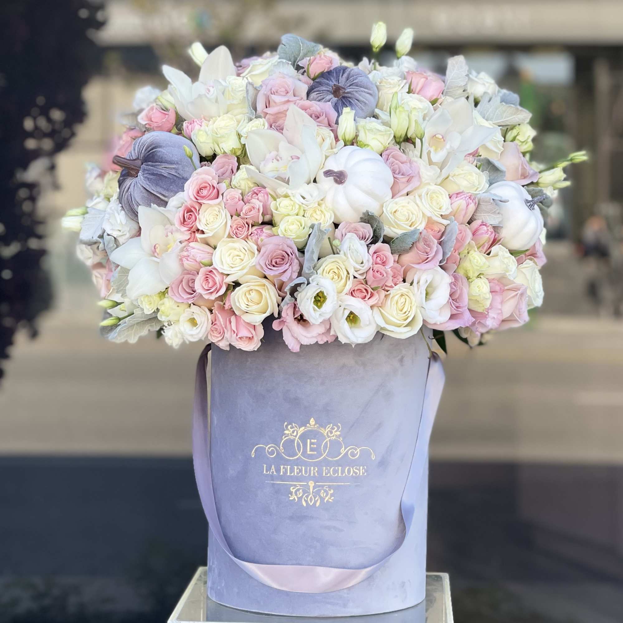 Beautiful very soft pastel colors arrangement in our signature grey velvet box