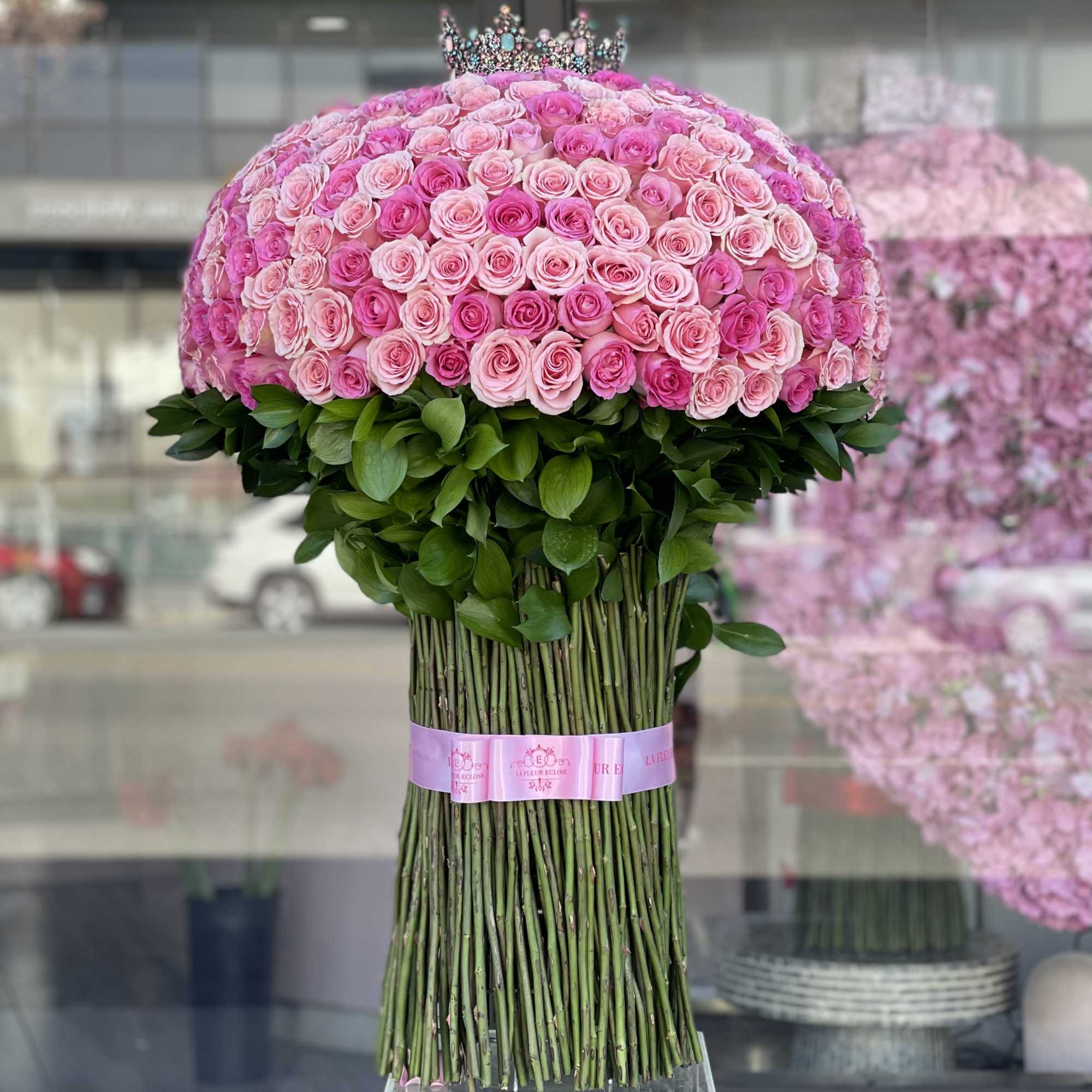 Large bouquet of pink roses with a crown topper, photo 2 of 2