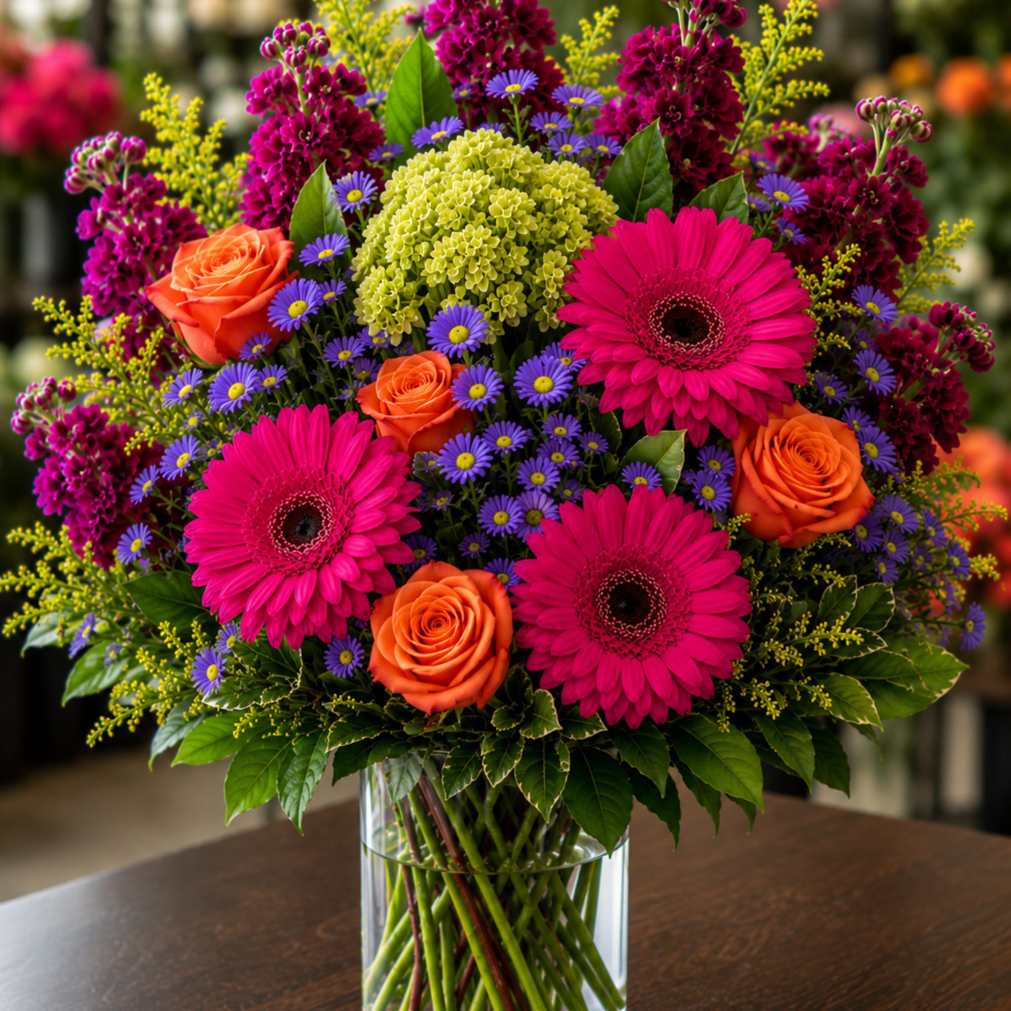 This dramatic display of beautiful blooms screams summertime joy! Lovely orange roses