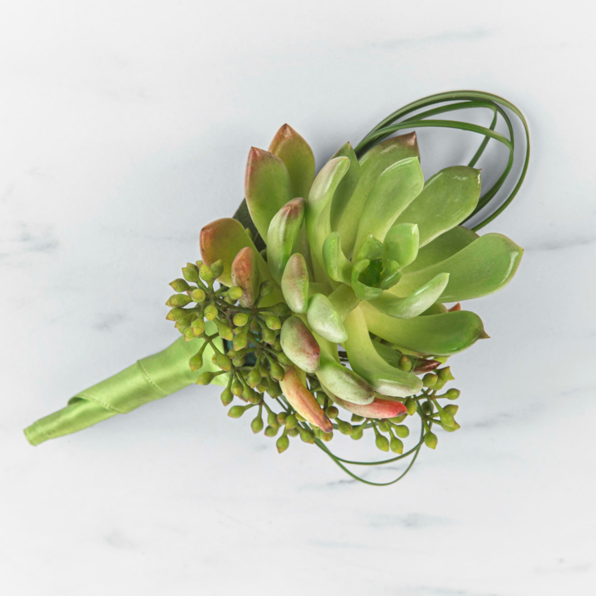 Succulent bouquet with green rosette plants and looping wire accents