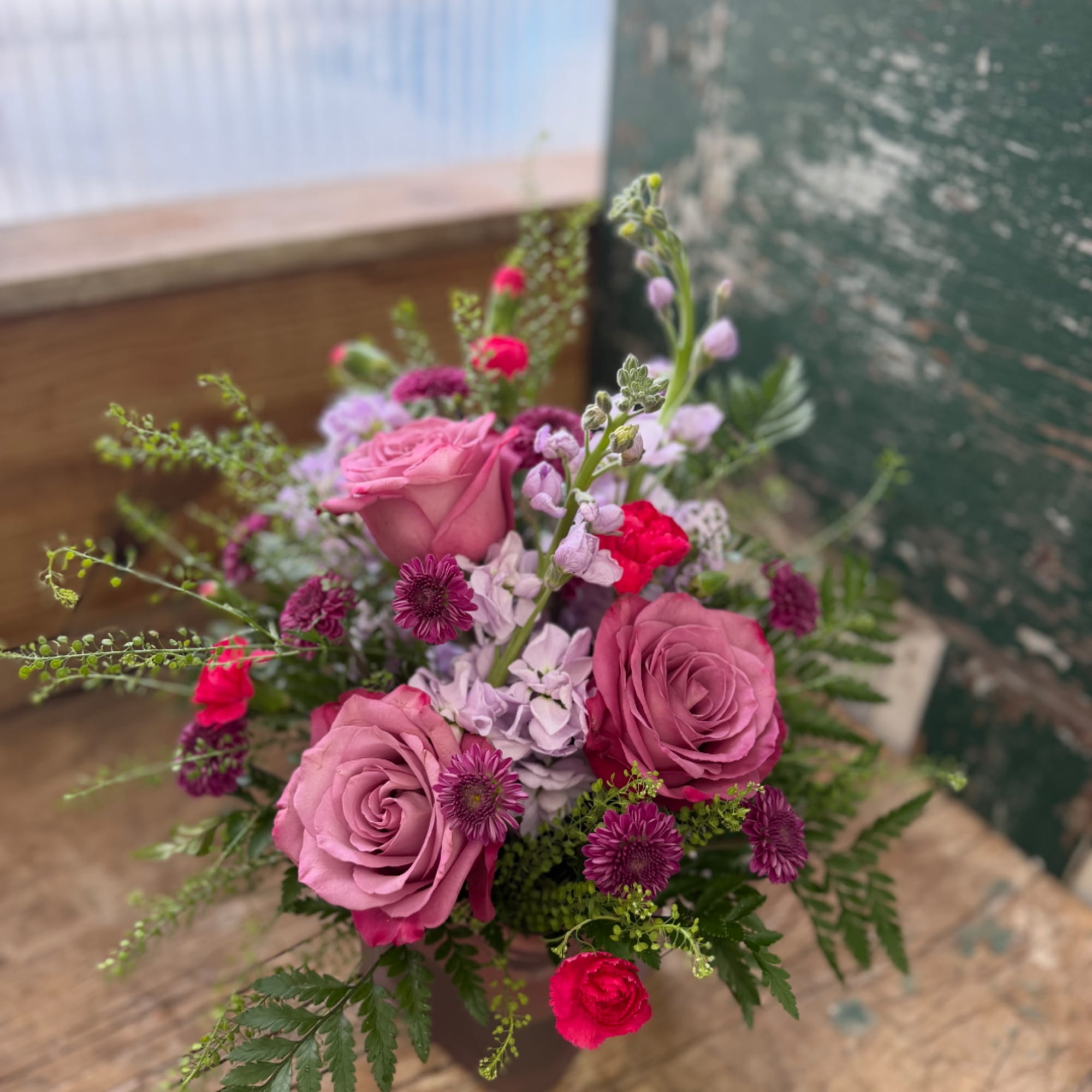Pink and purple mixed bouquet in a vase