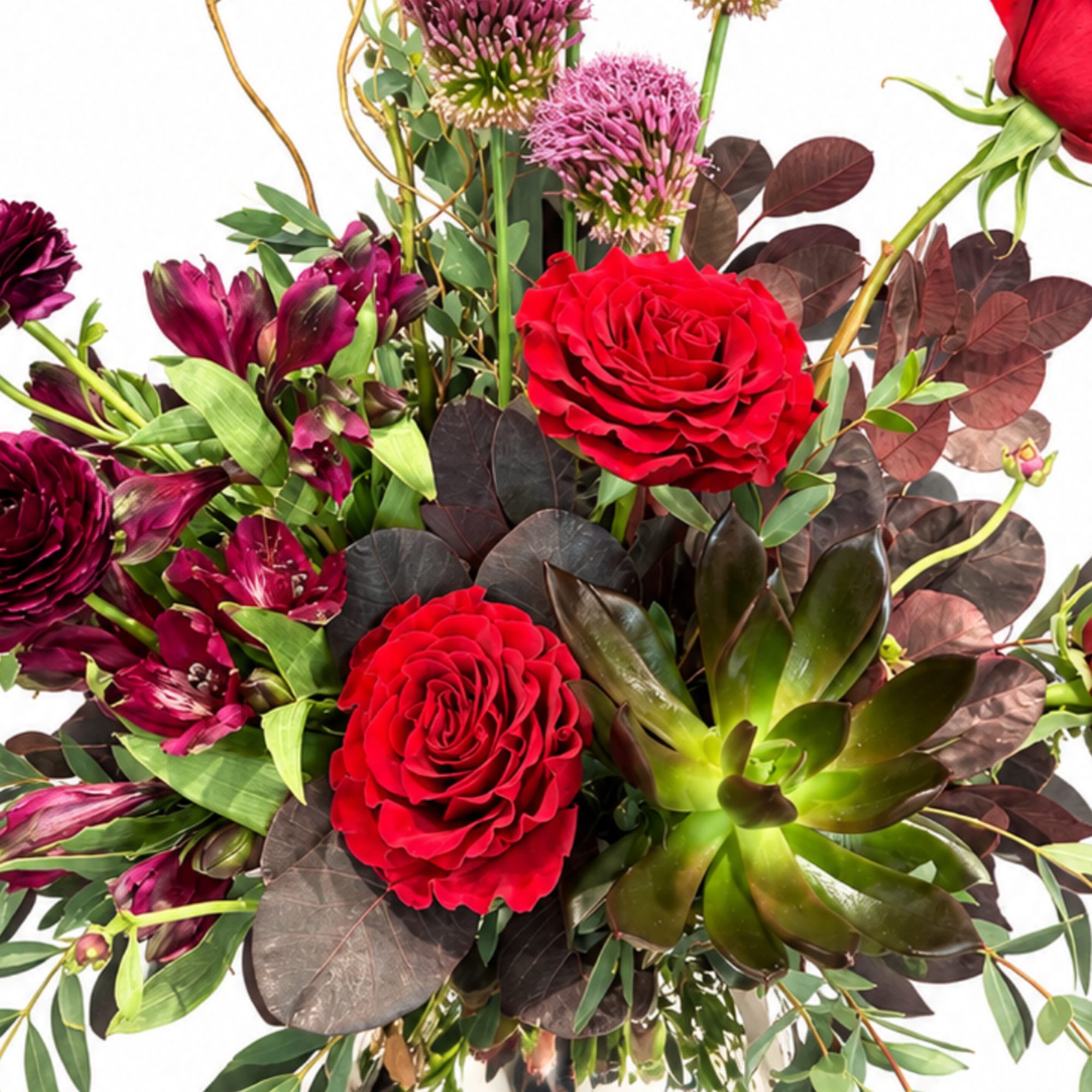 Bouquet of red roses, burgundy flowers, and green succulent-like foliage