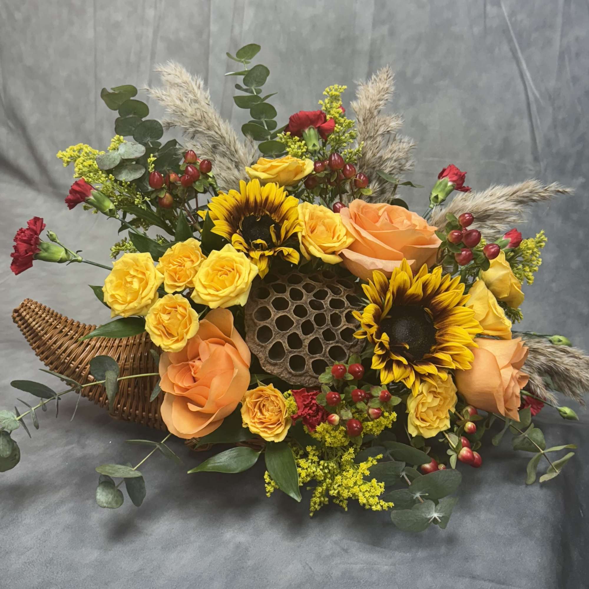 Introducing our Harvest Cornucopia a stunning arrangement featuring vibrant sunflowers and unique, photo 2 of 2