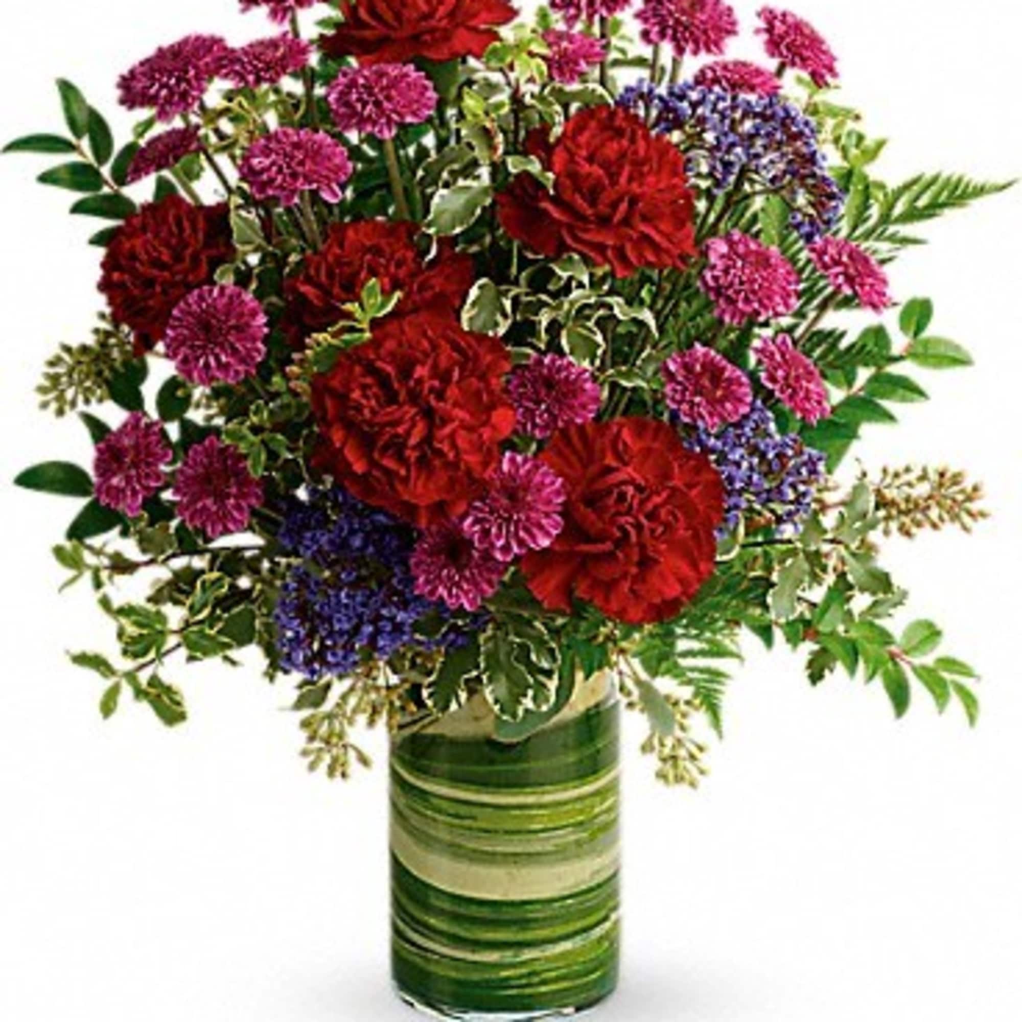 Rich and radiant, this vivid mix of jewel-toned blooms is wrapped with