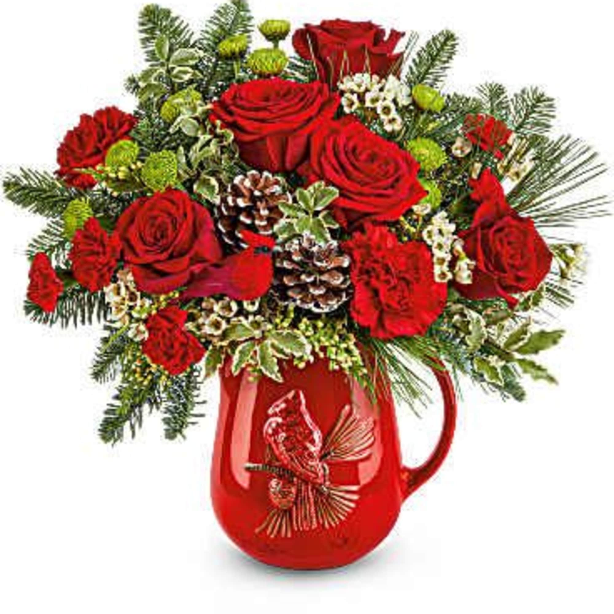  Festive Flight Bouquet spreads holiday cheer with red blooms, winter greens