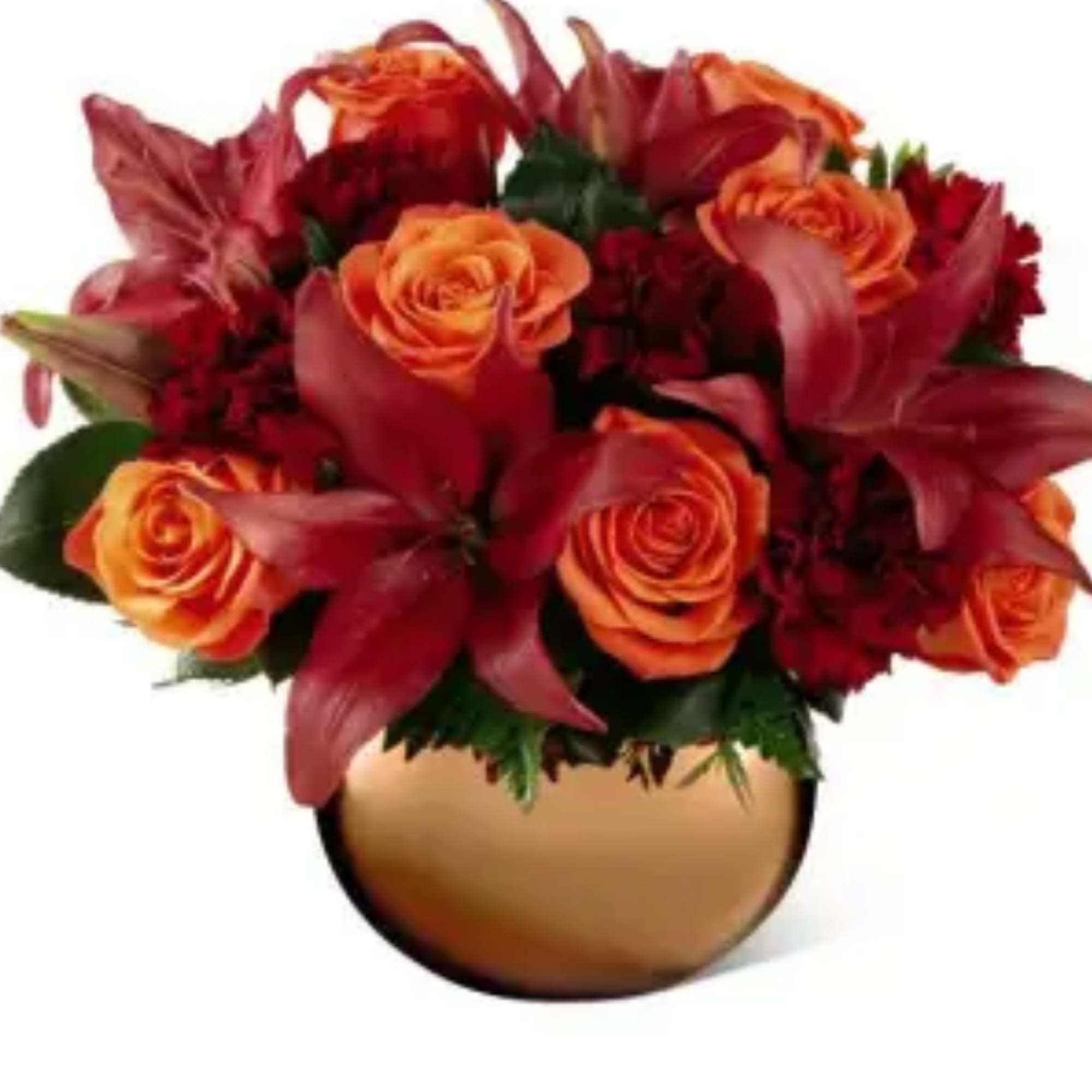 Orange roses and red lilies in a round gold vase