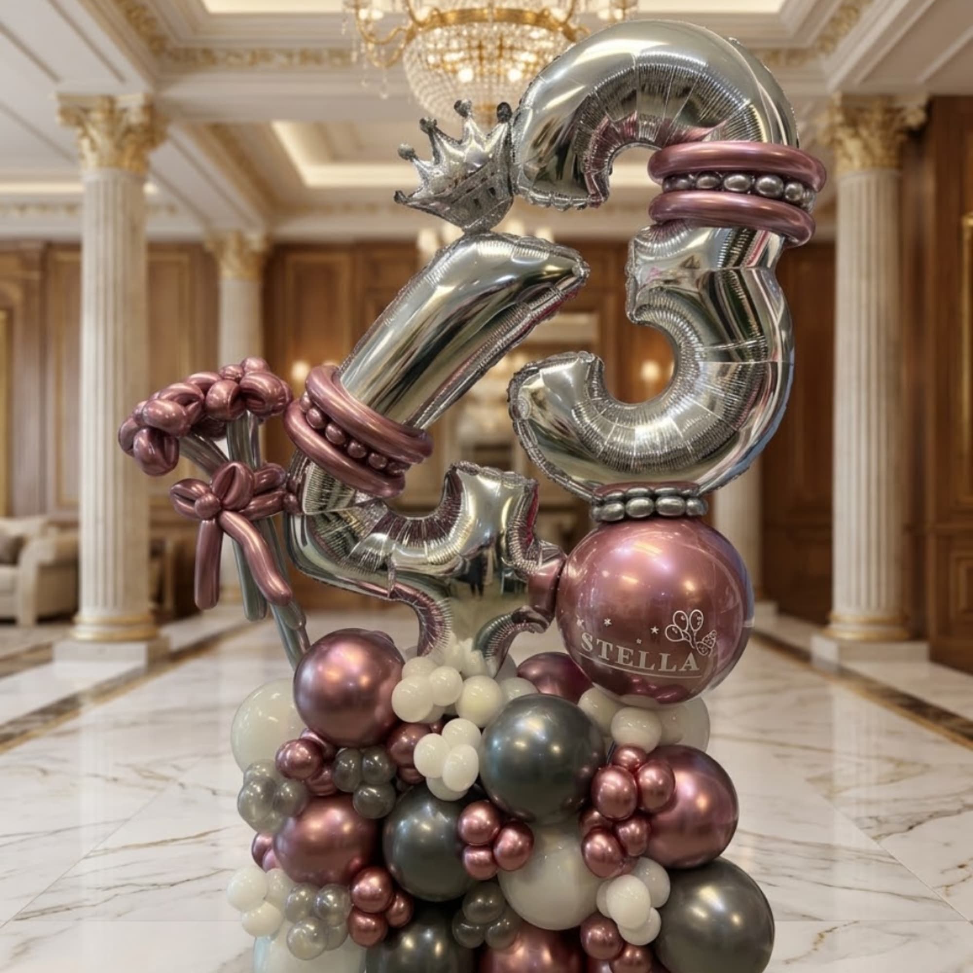 Balloon arrangement with silver number balloons and pink metallic balloons