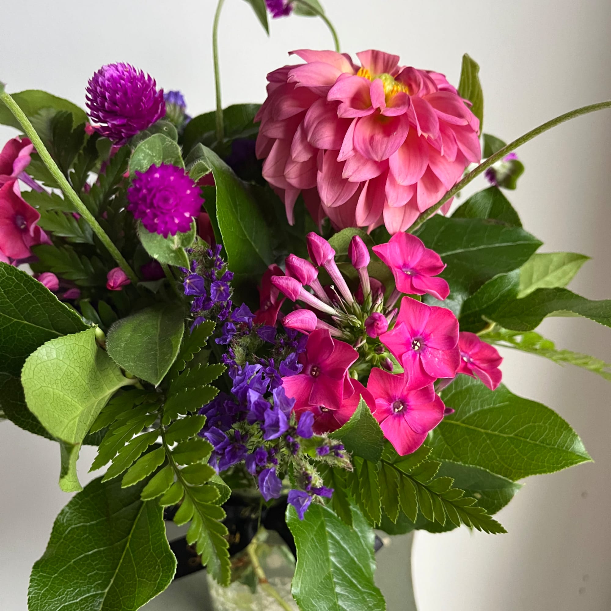 Pink and purple mixed bouquet with a large pink bloom