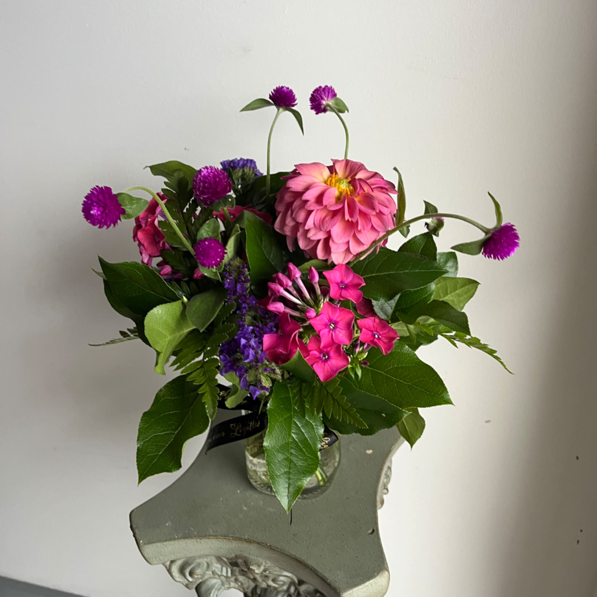 Pink and purple mixed bouquet in a clear glass vase