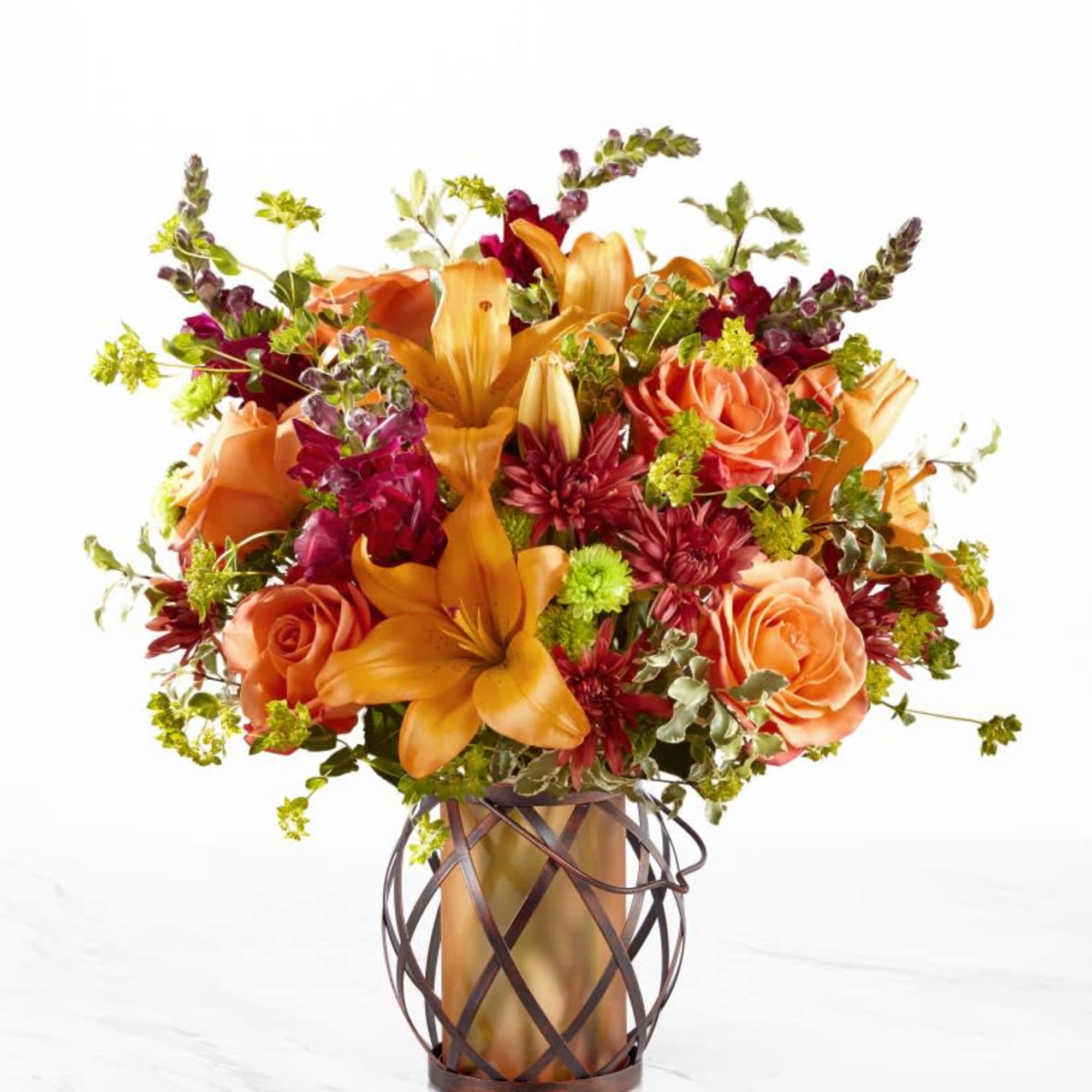 Roses, snapdragons, and lilies fill a lovely keepsake lantern or similar keepsake, photo 3 of 3