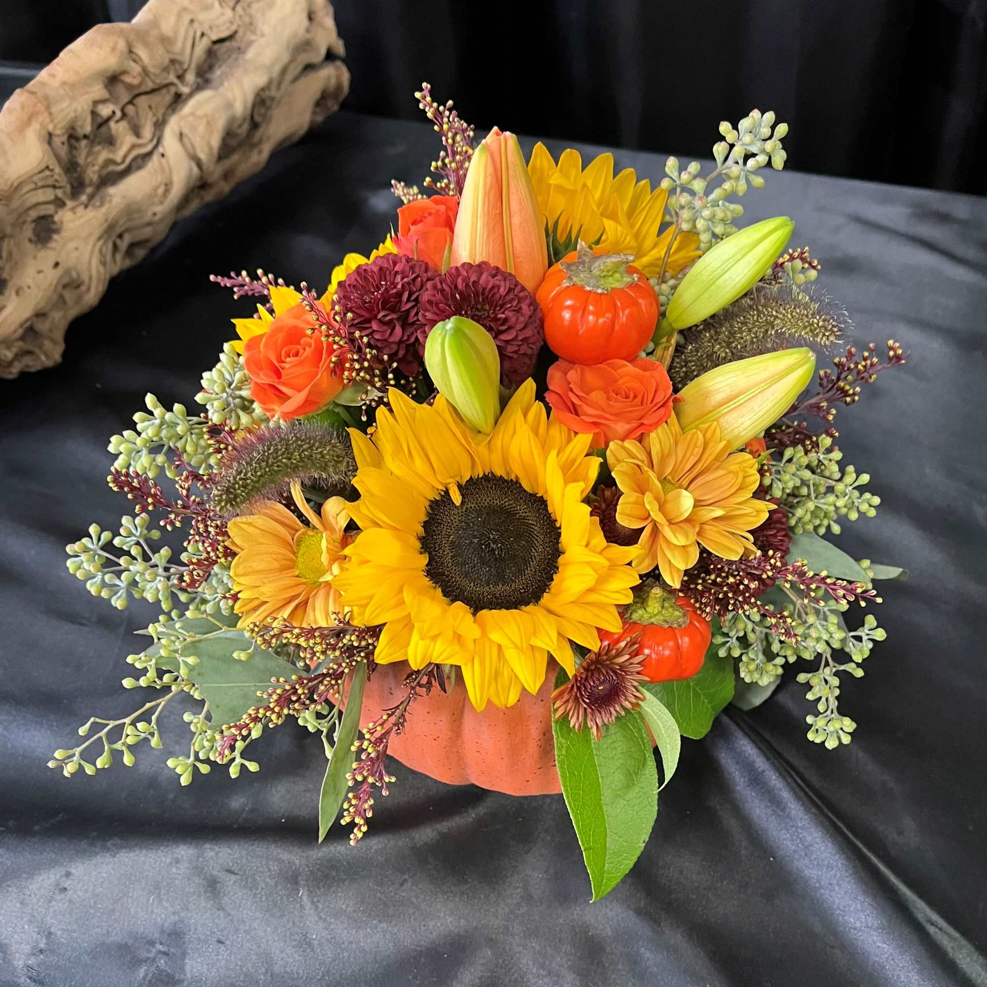 Perfect for a small centerpiece. A beautiful fall flowers in an orange