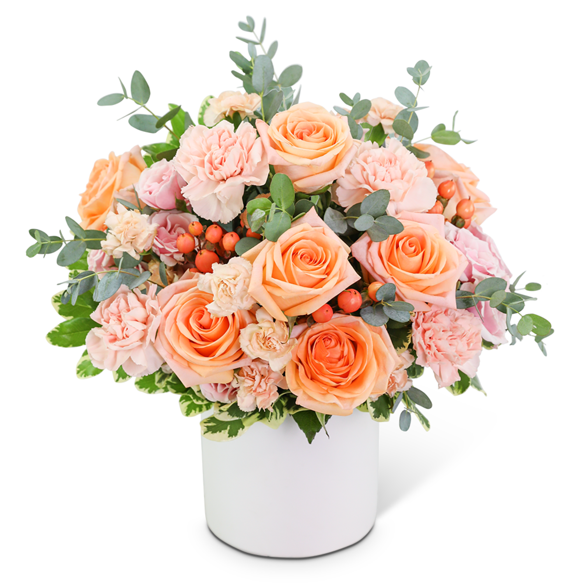 Peach roses and pink carnations in a white vase