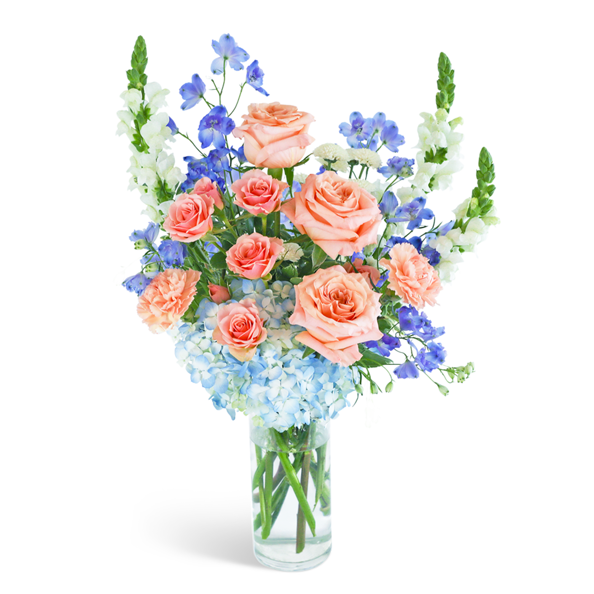 Peach roses and blue flowers in a clear glass vase