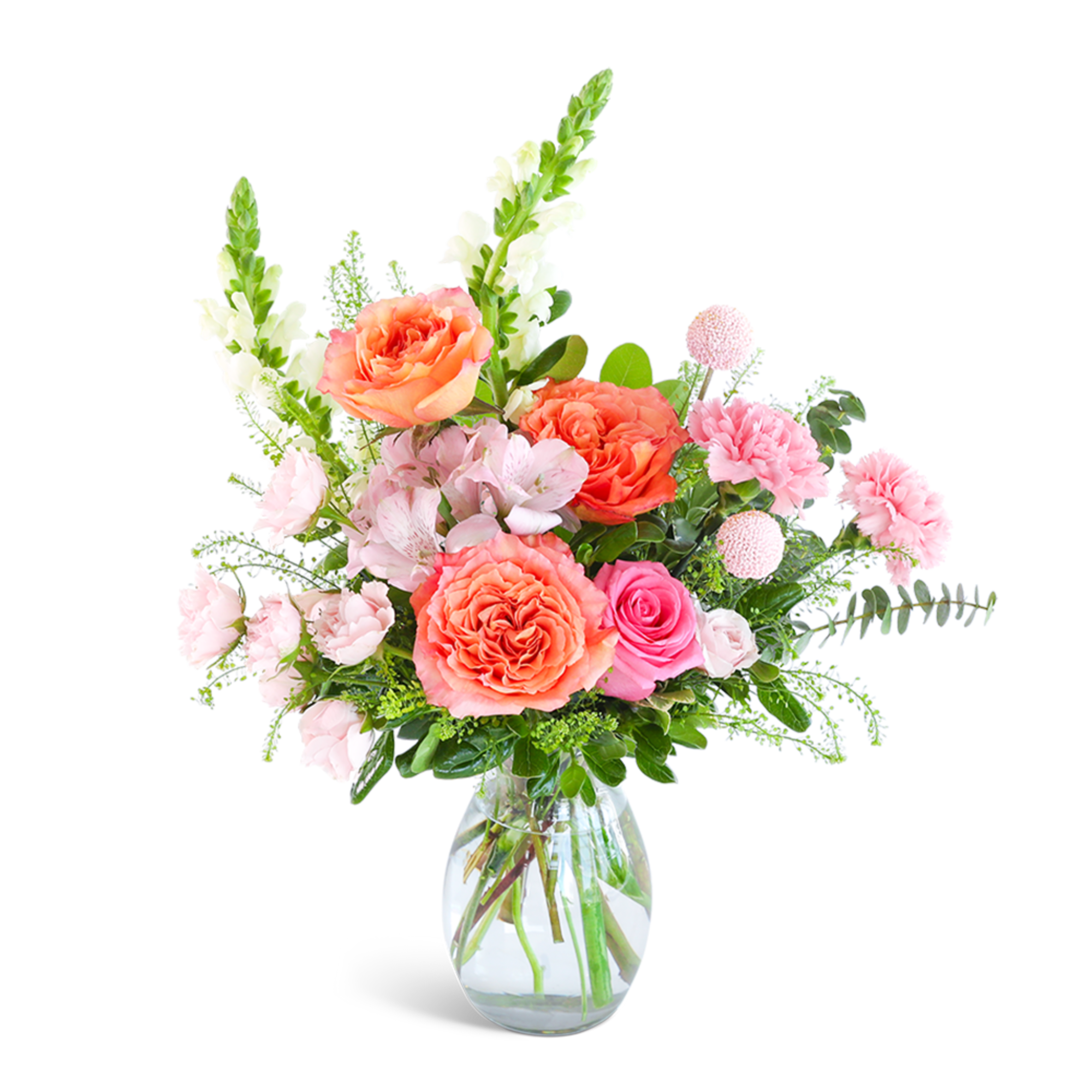 Pink and coral flower arrangement in a clear glass vase