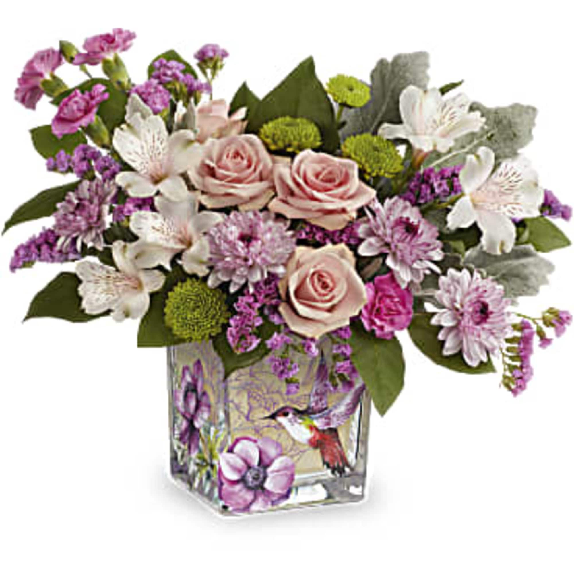 Pink roses and white flowers in a square glass vase