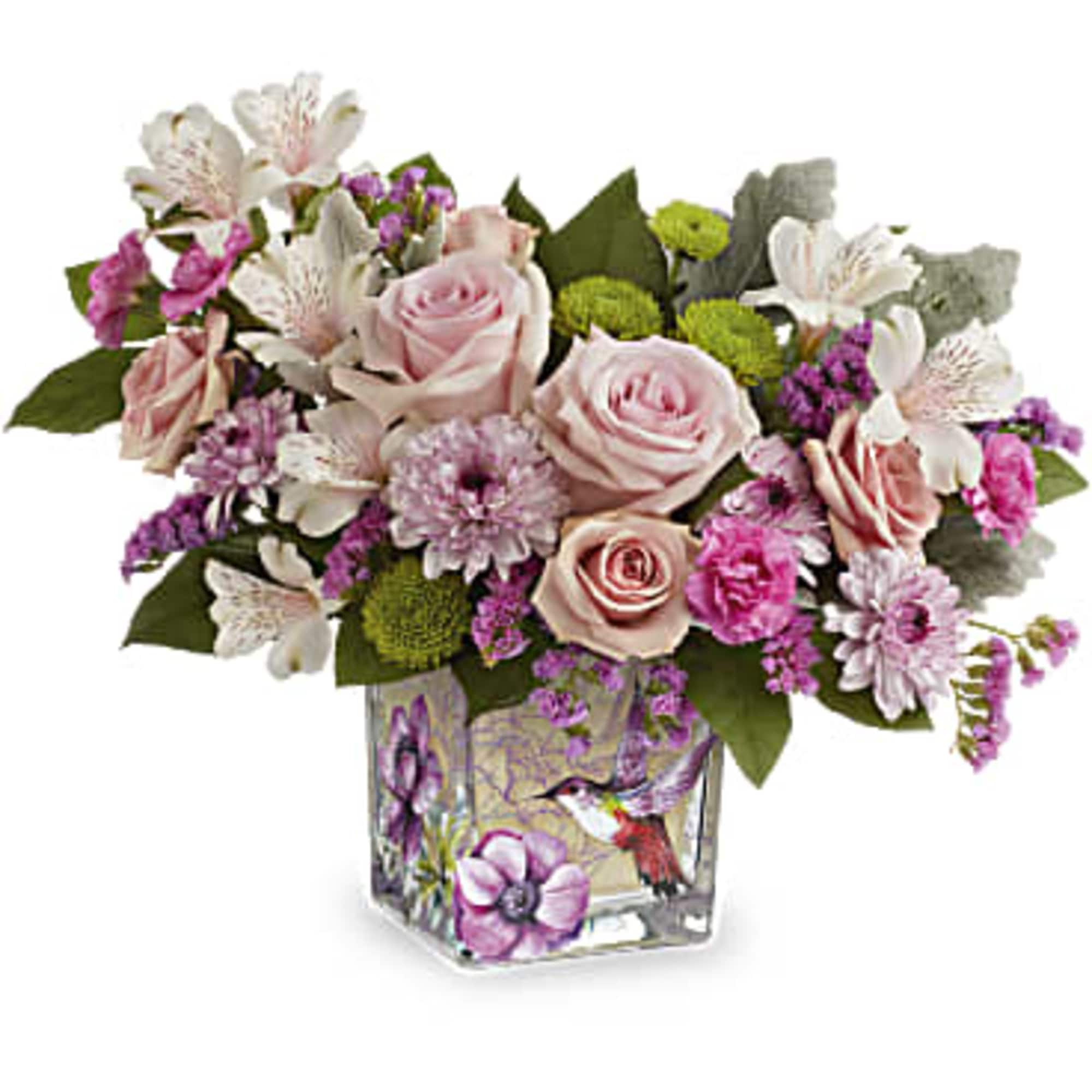 Pink roses and white flowers in a square glass vase