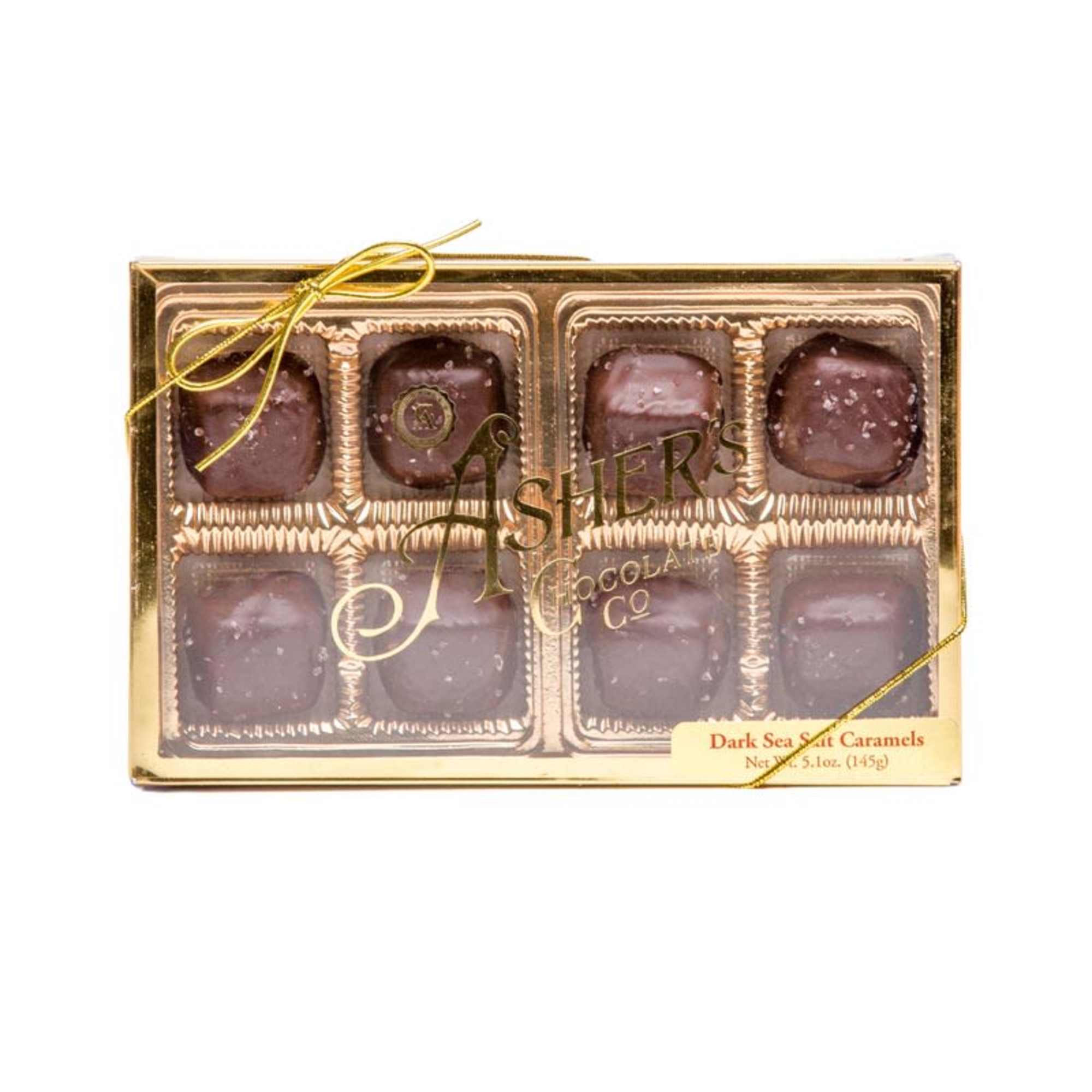 Box of dark chocolate sea salt caramels with a gold ribbon