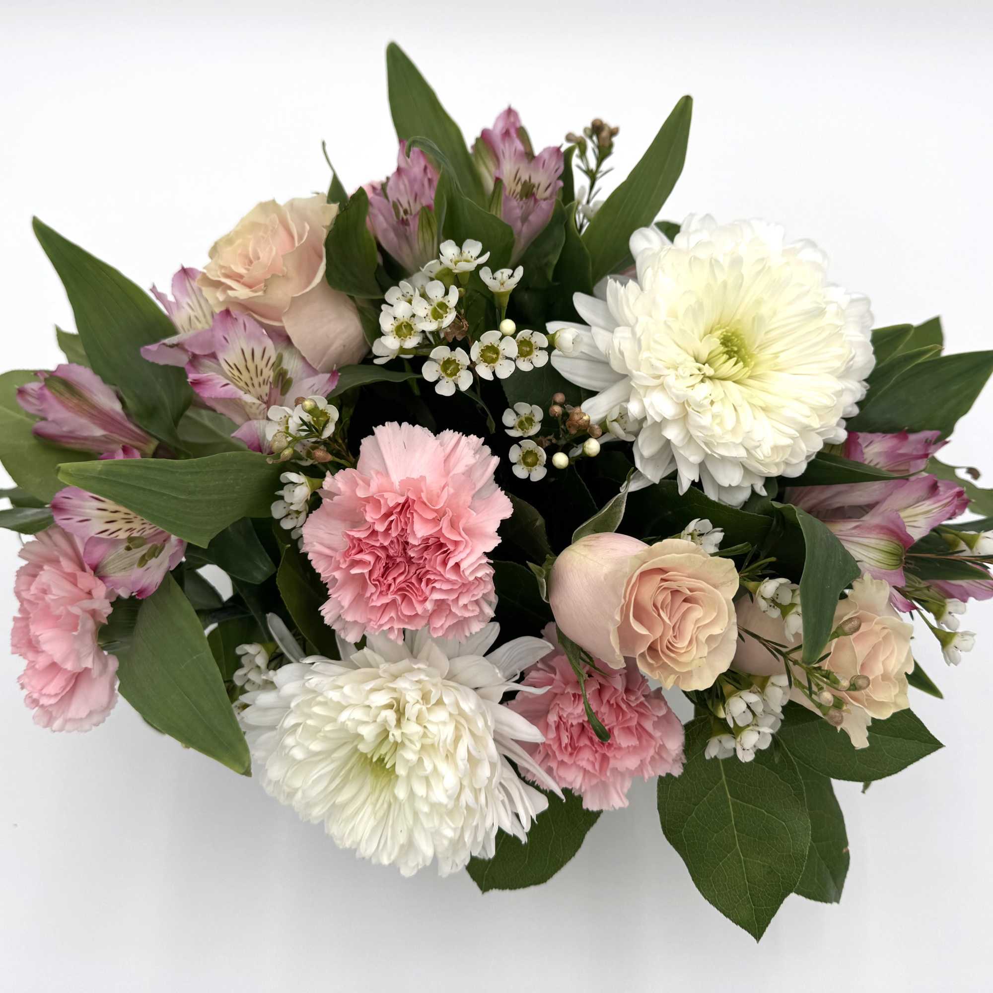 Bouquet of pink and white flowers with green foliage