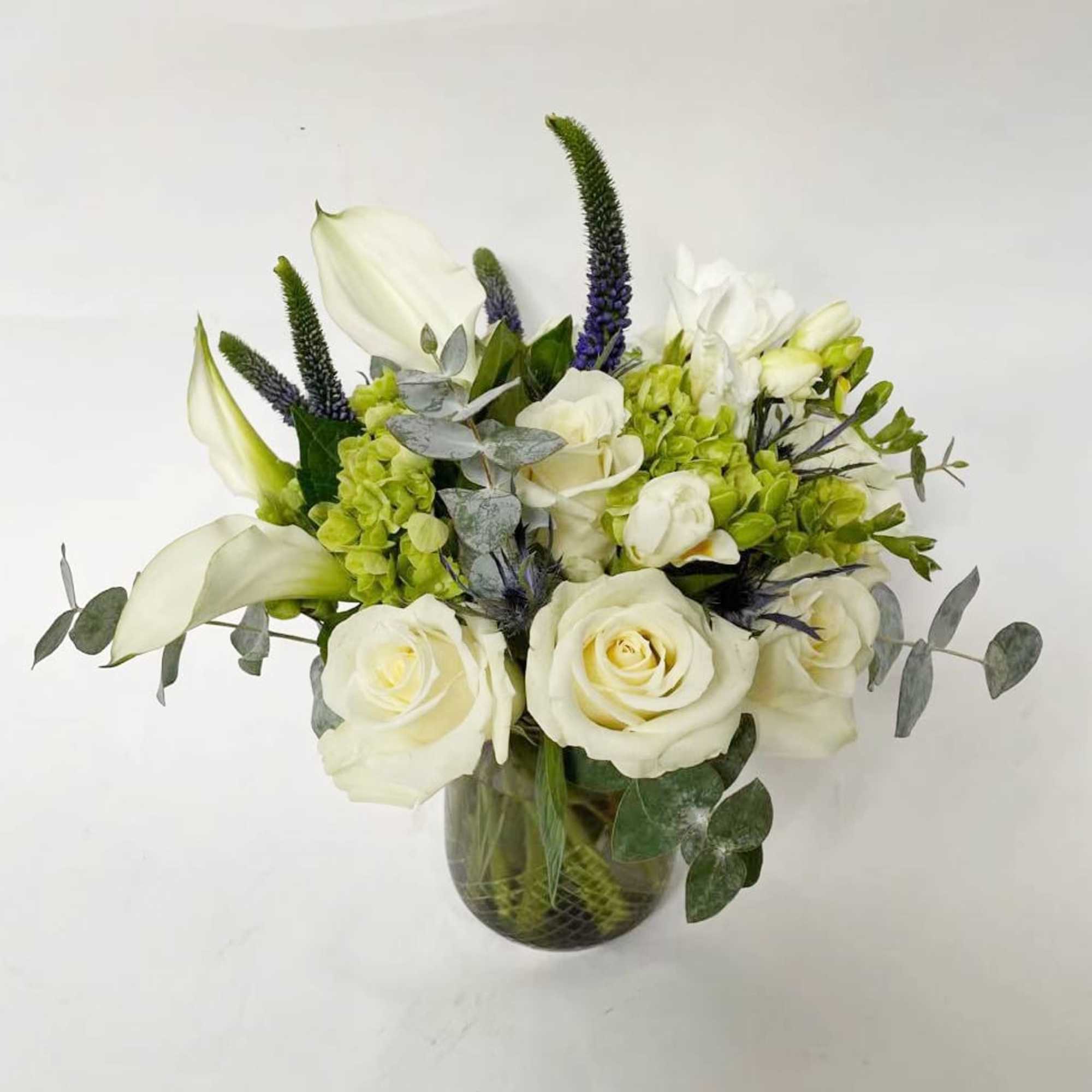 This perfectly petite flower arrangement is a lovely centerpiece for your coffee