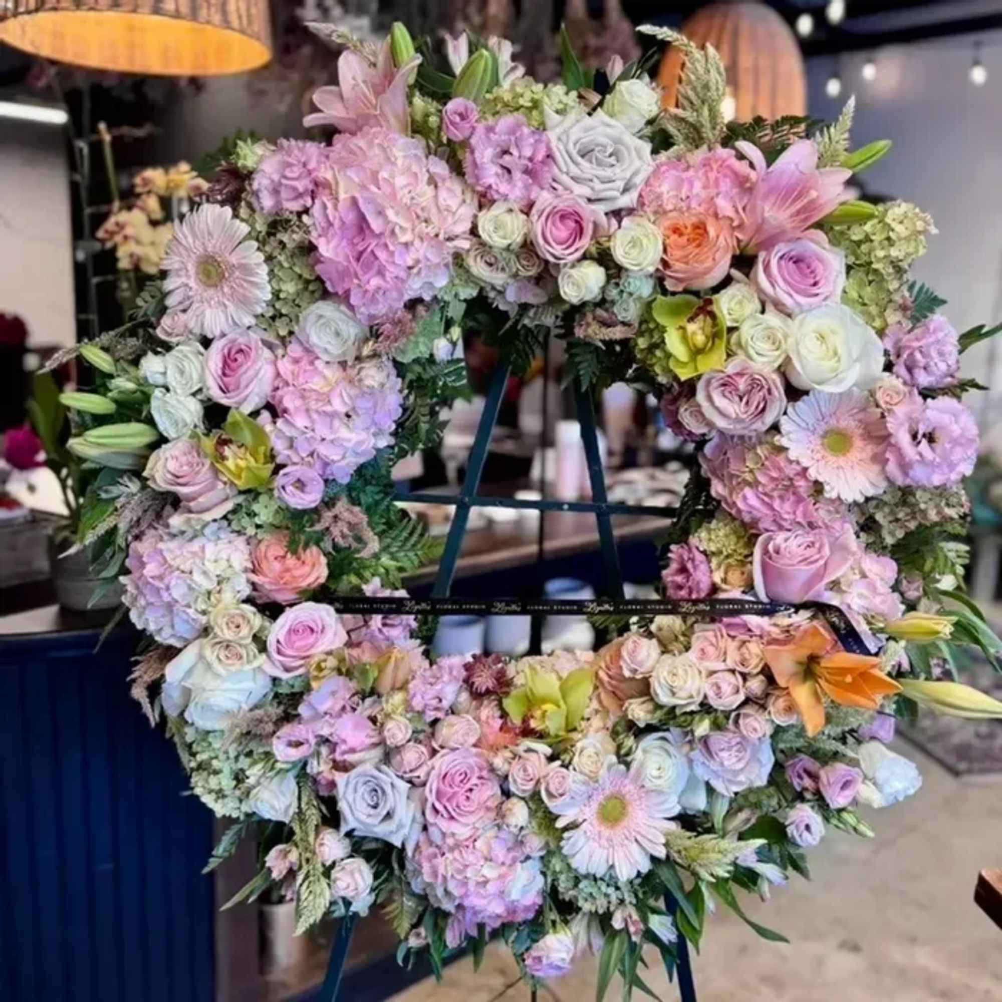 Honor the memory of a loved one with our Standing Floral Wreath