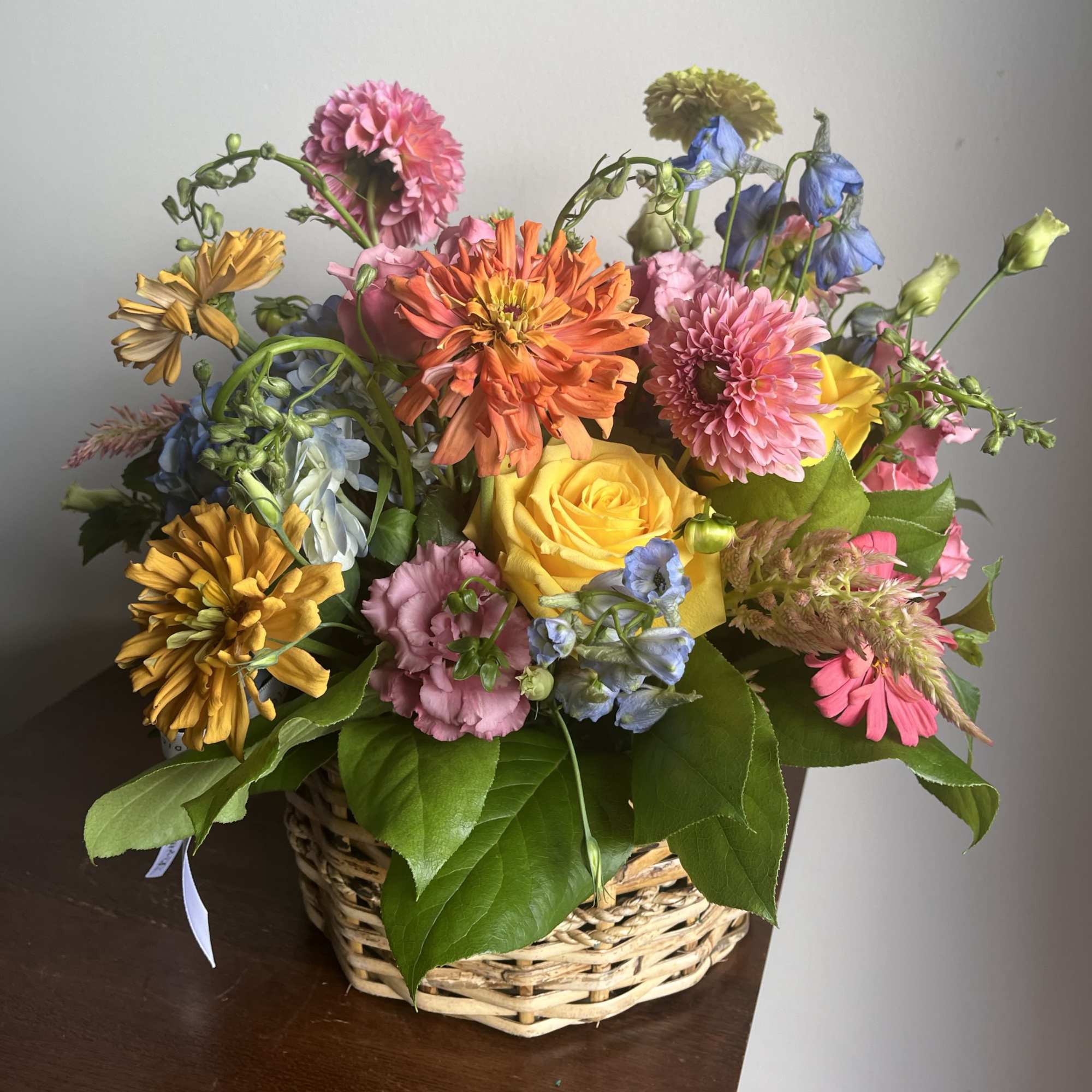Elevate the classic basket arrangement with a custom-designed display of fresh, seasonal