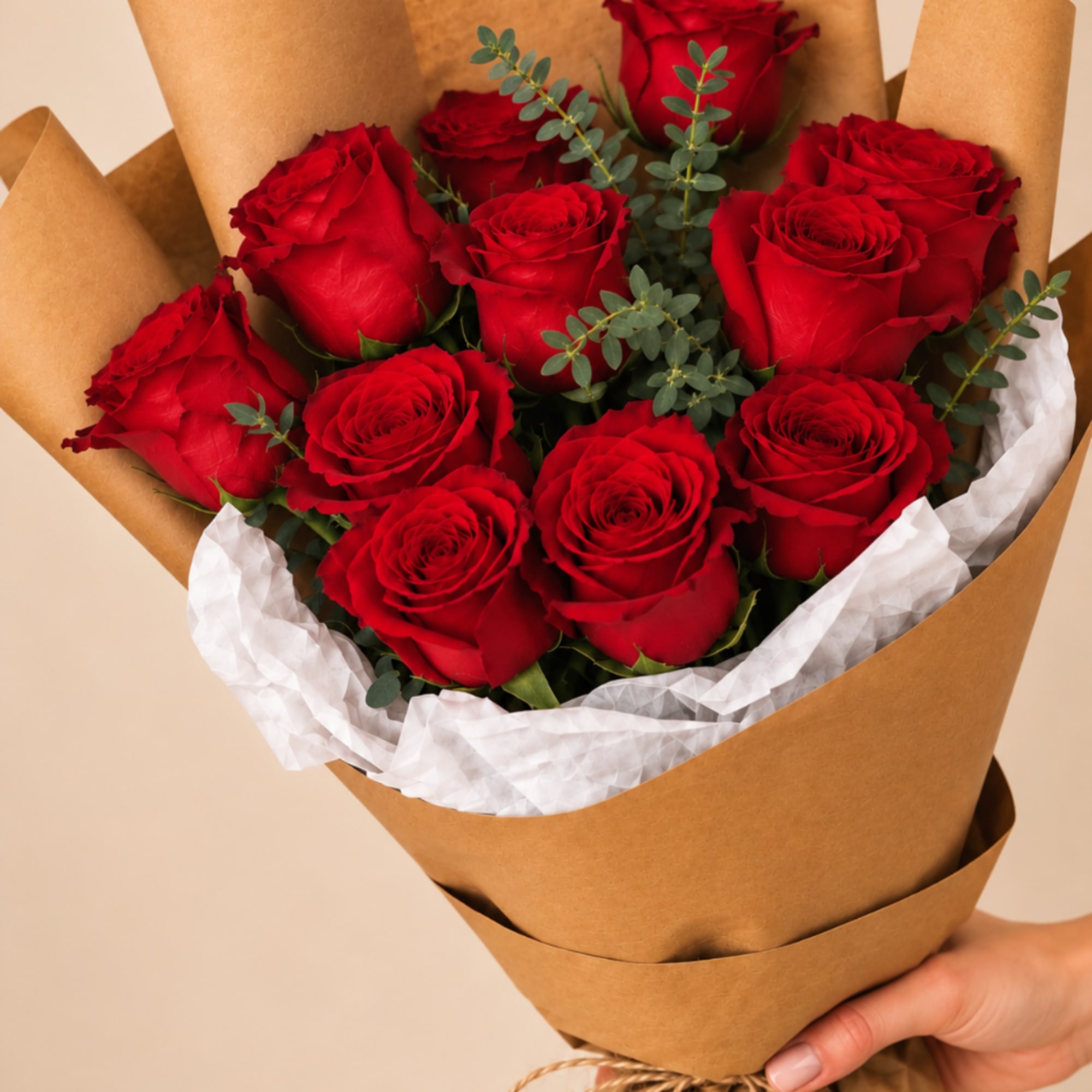Bouquet of red roses wrapped in brown paper, photo 2 of 3