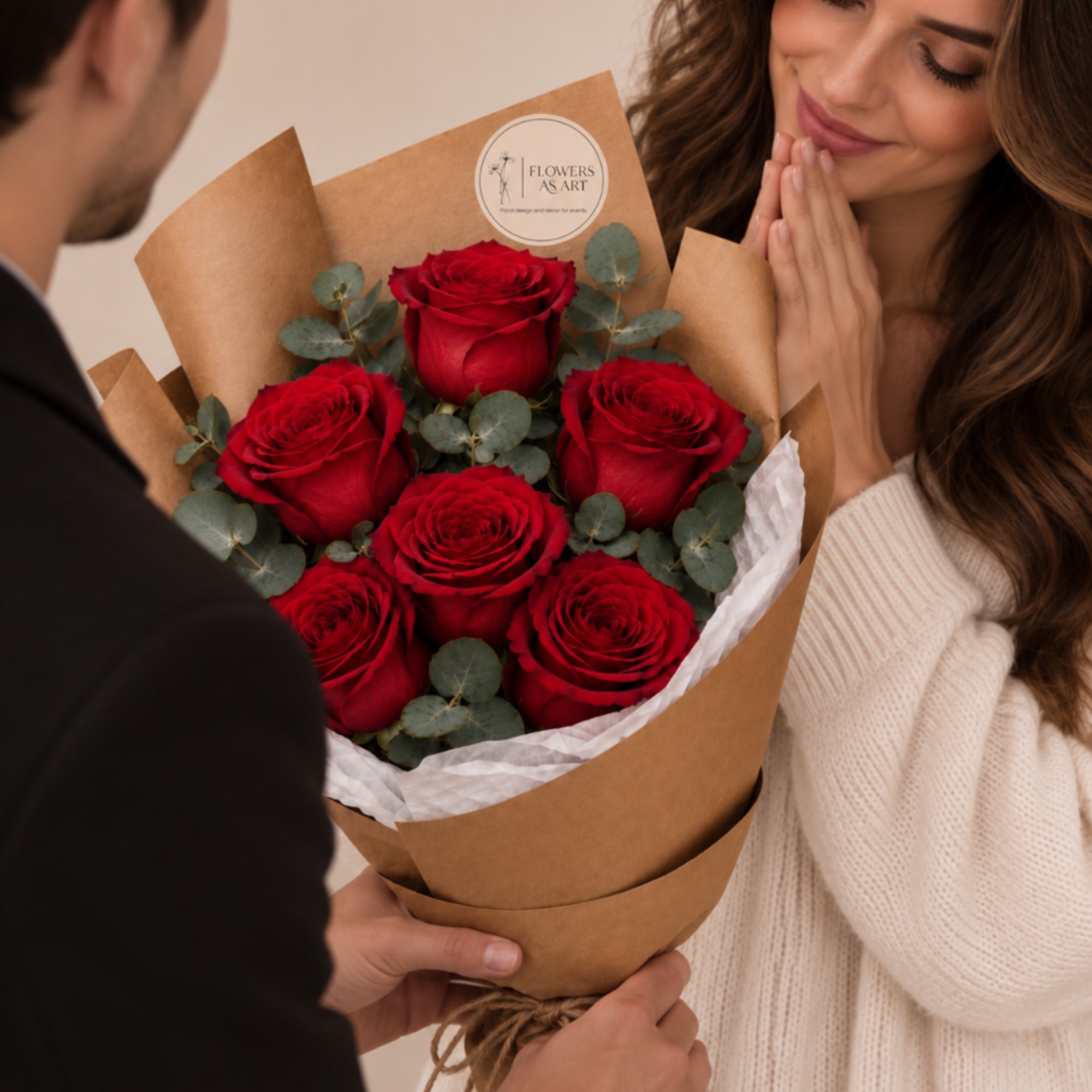 Bouquet of red roses wrapped in brown paper