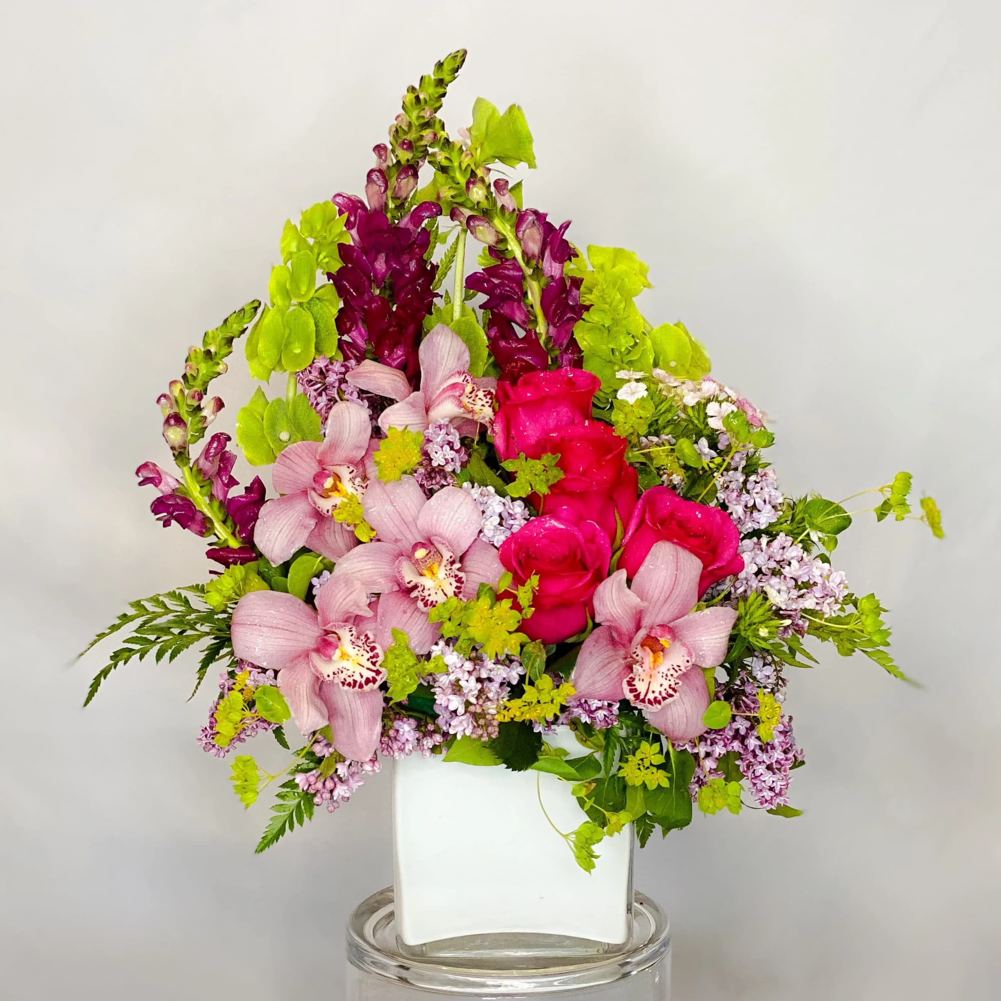 Escape to paradise with this lush and vibrant bouquet. This arrangement contains