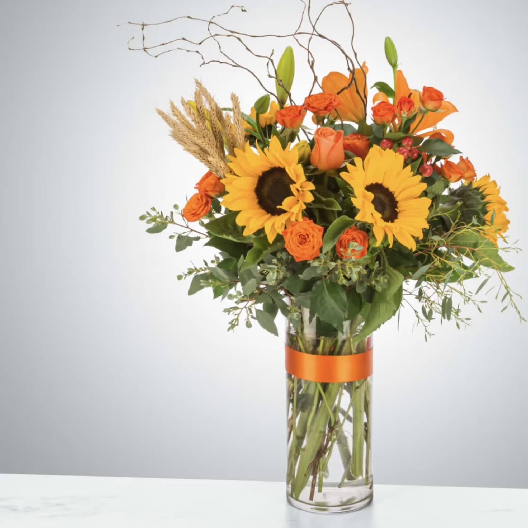The ultimate fall flower mix featuring sunflowers and a variety of orange