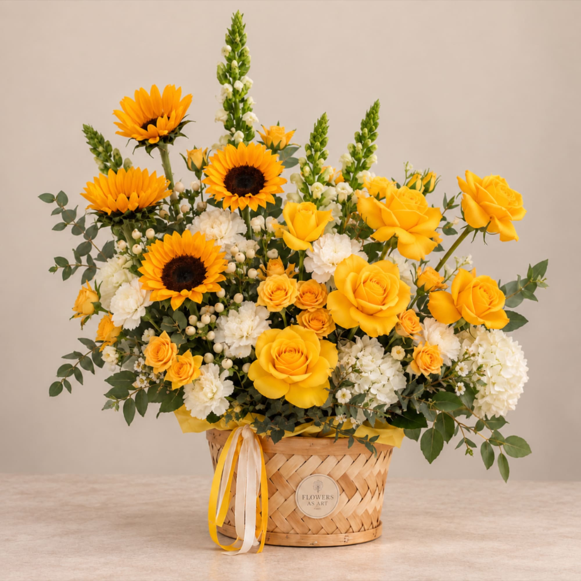 Yellow roses and sunflowers arranged in a woven basket