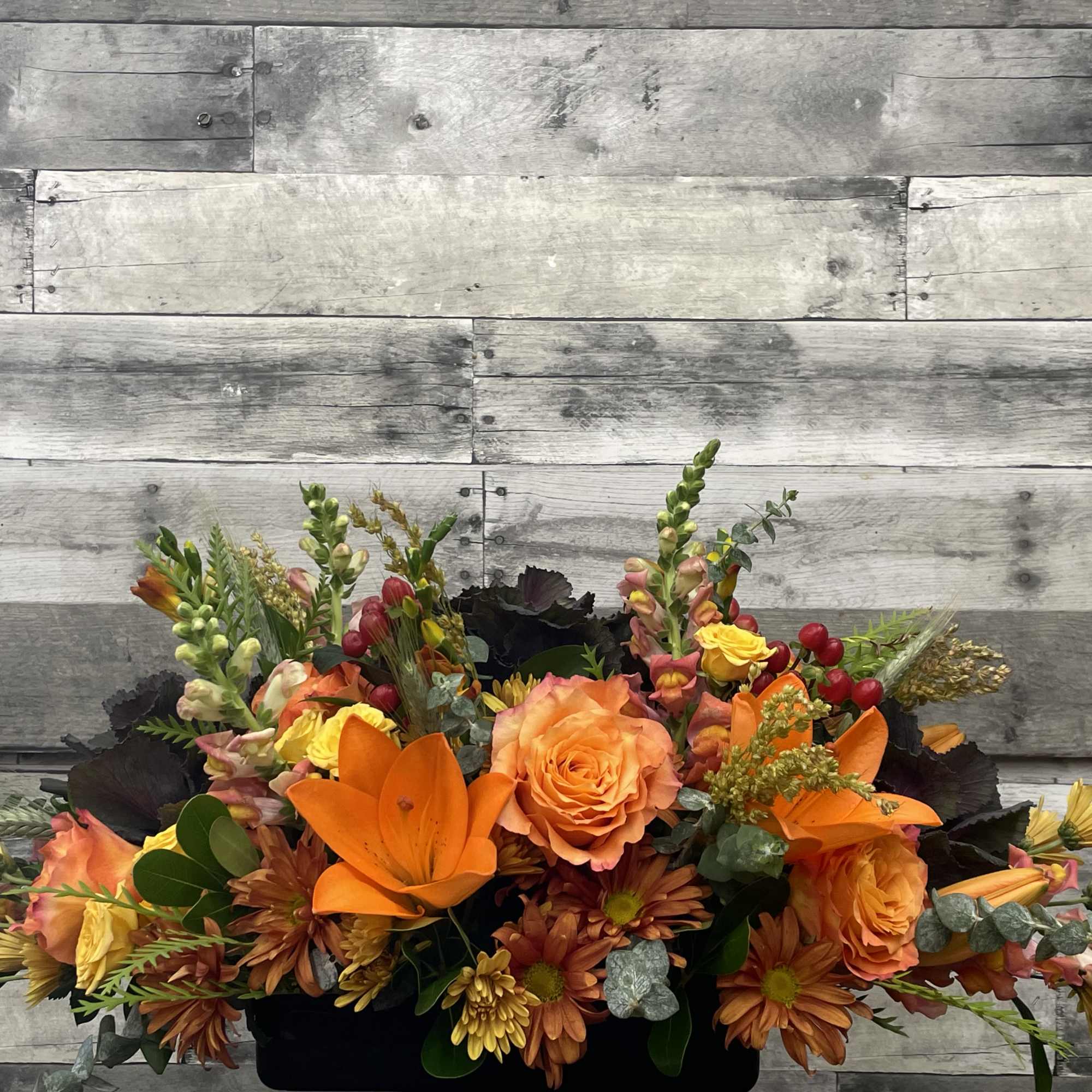 A lovely centerpiece with all the splendor of fall!  Kale, lilies, photo 2 of 2