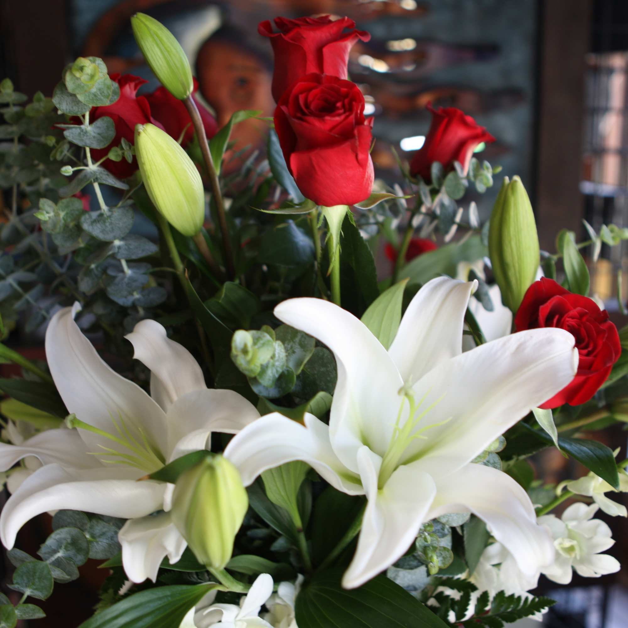 Bouquet of red roses and white lilies with greenery, photo 3 of 3