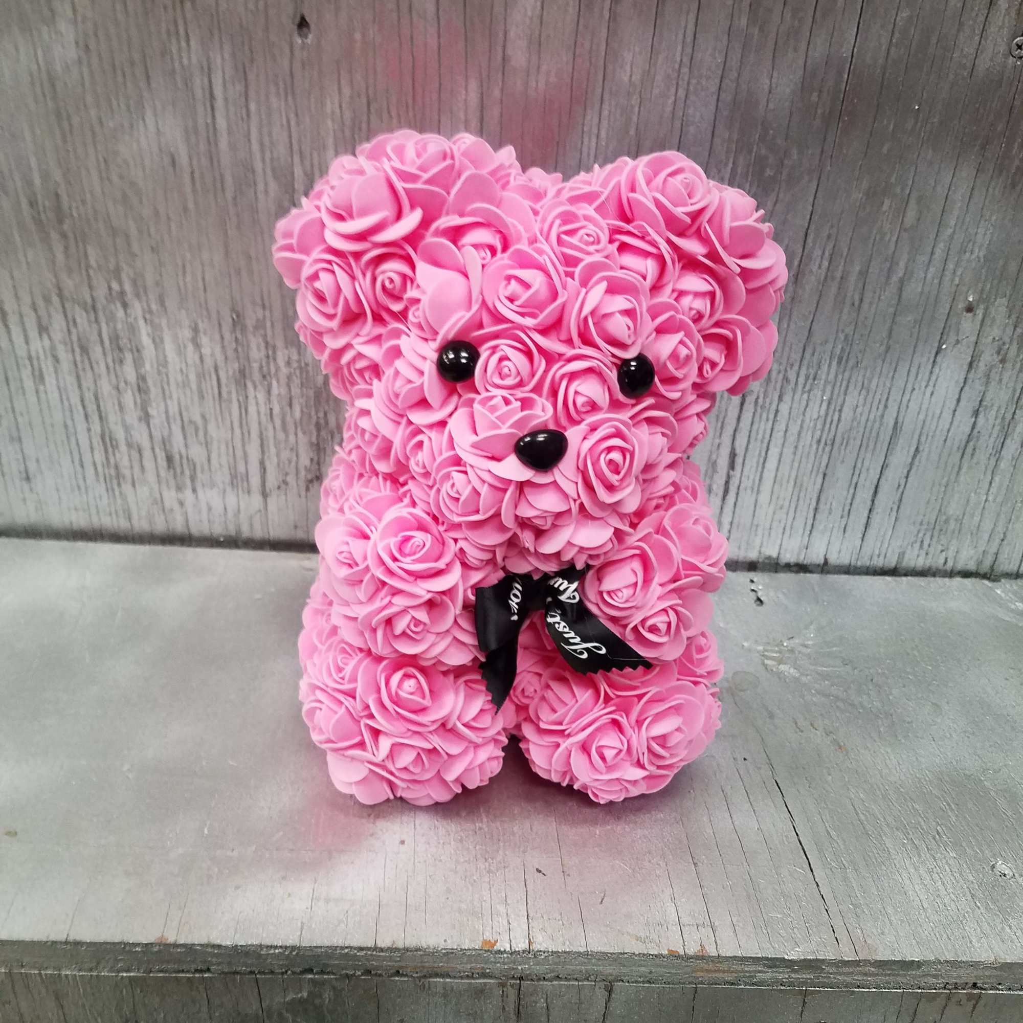 Pink rose teddy bear with black ribbon
