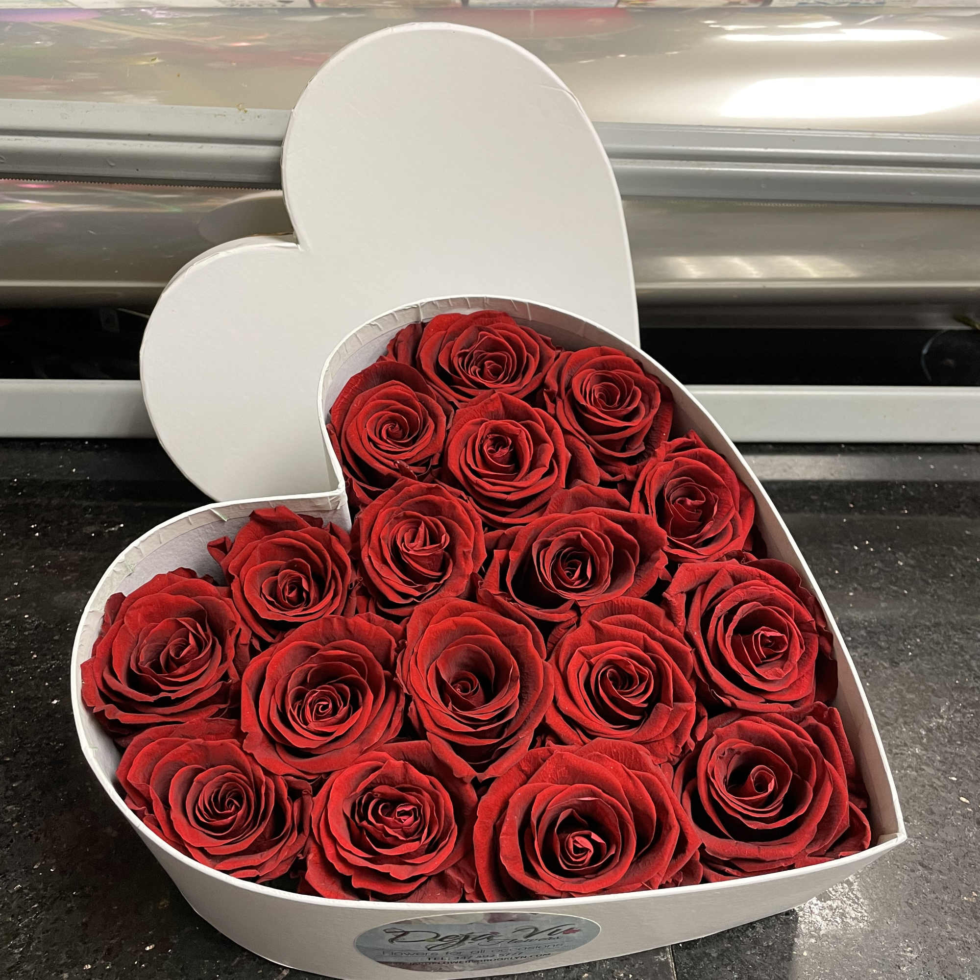 Heart-shaped box filled with red roses
