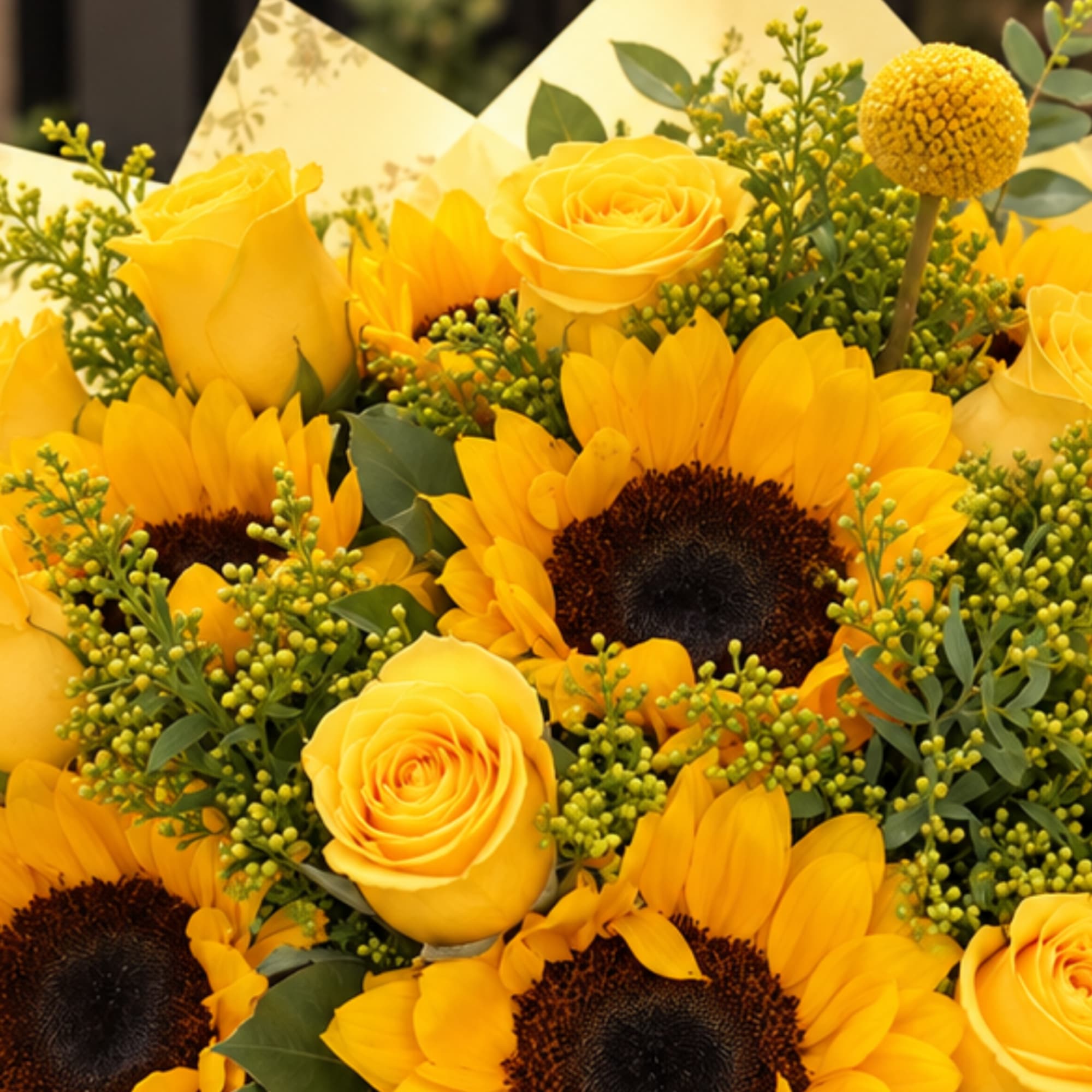 Yellow roses and sunflowers in a dense bouquet