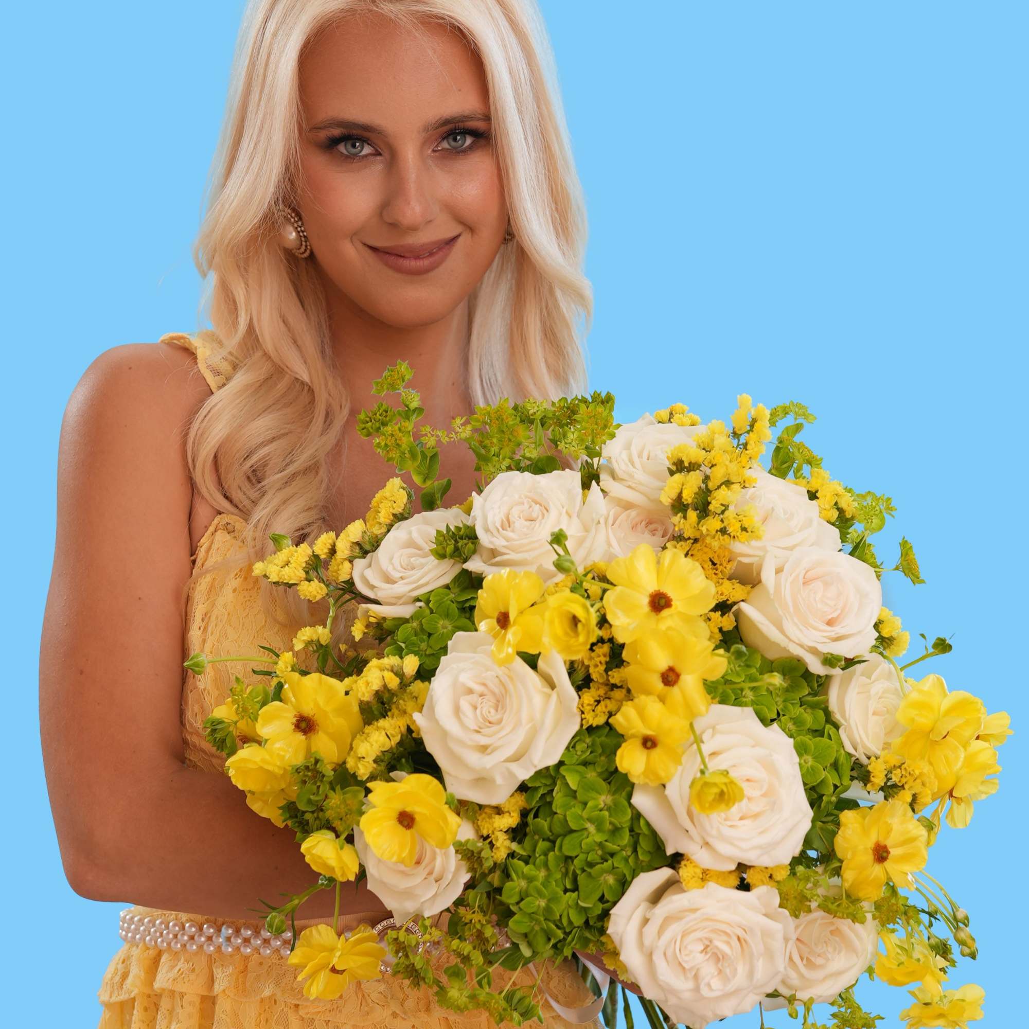 Woman holding a bouquet of white roses and yellow flowers, photo 2 of 3