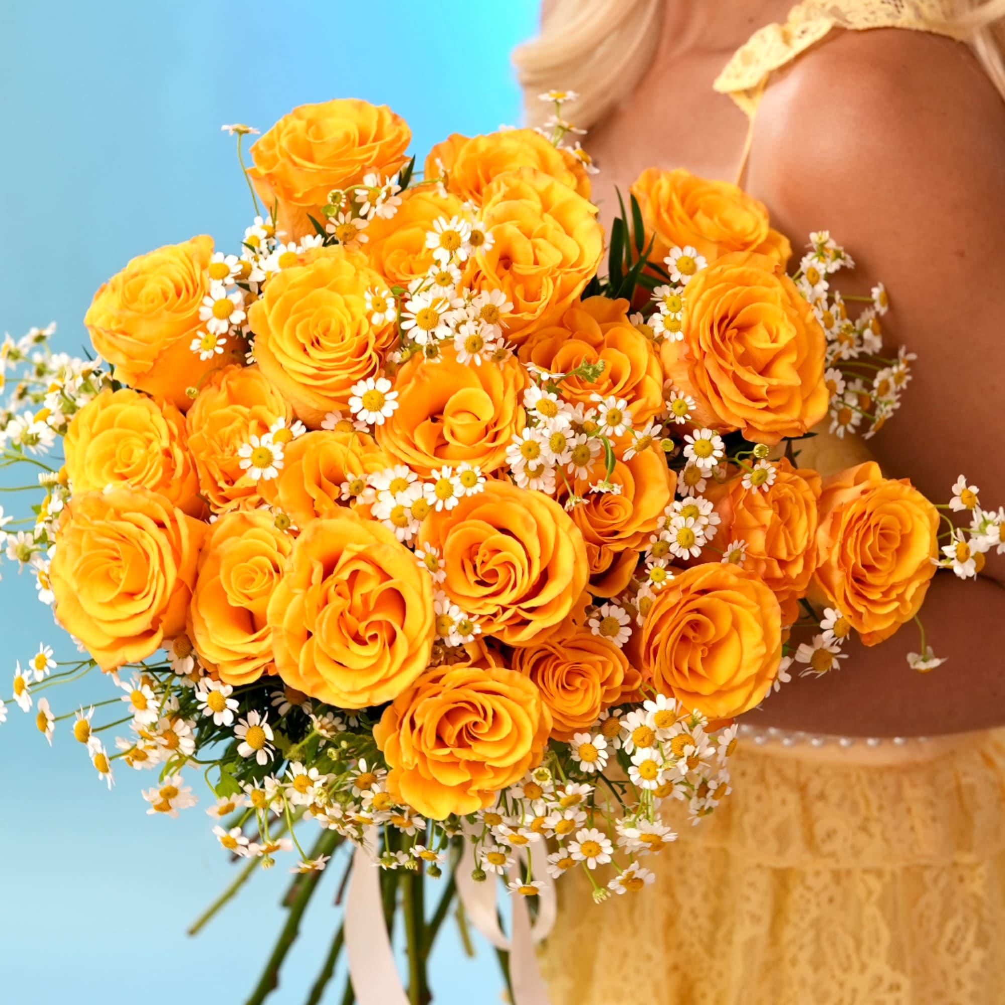 Bouquet of orange roses with small white daisies