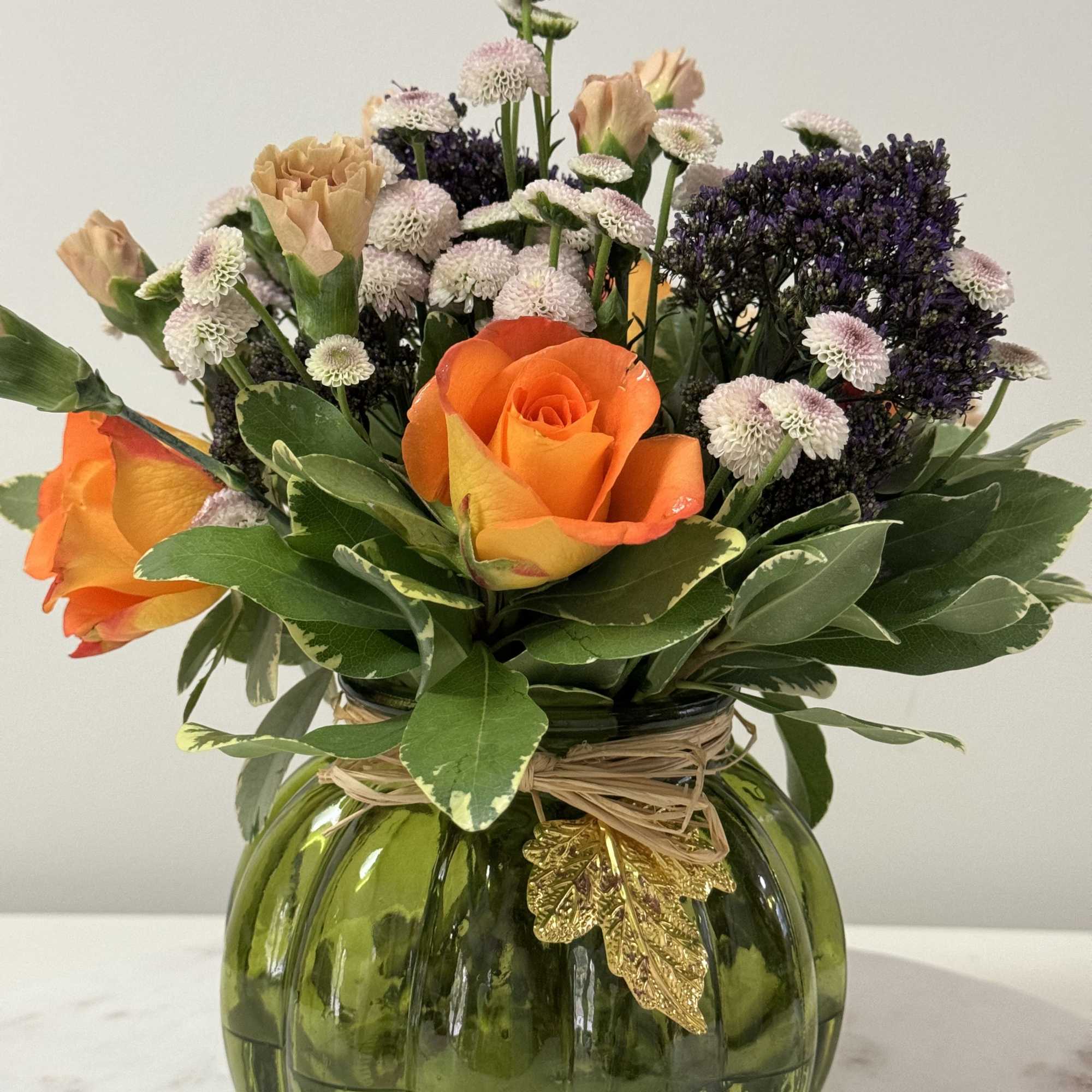 A natural and fresh pumpkin with flowers with  fall colors the, photo 2 of 2