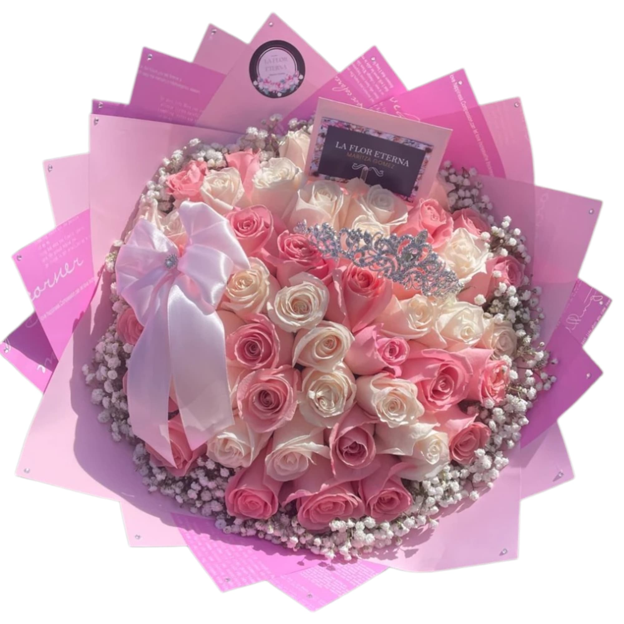 A tightly clustered round bouquet of soft pink and cream roses surrounded