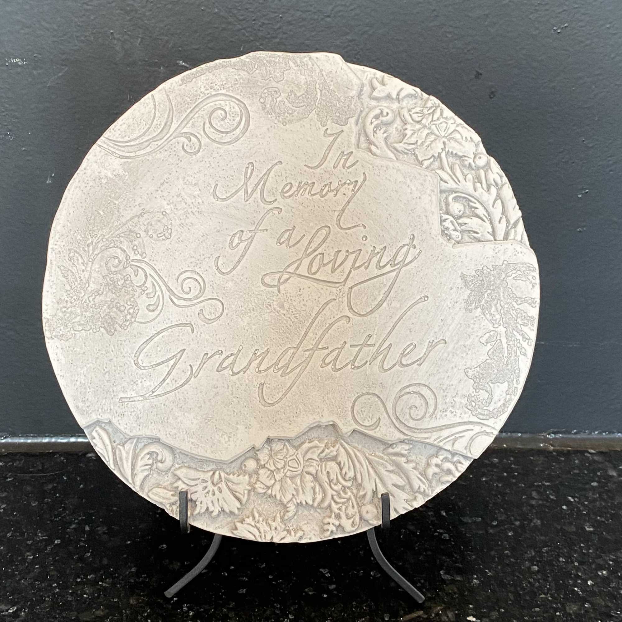 Round memorial plaque with the words In Memory of a Loving Grandfather