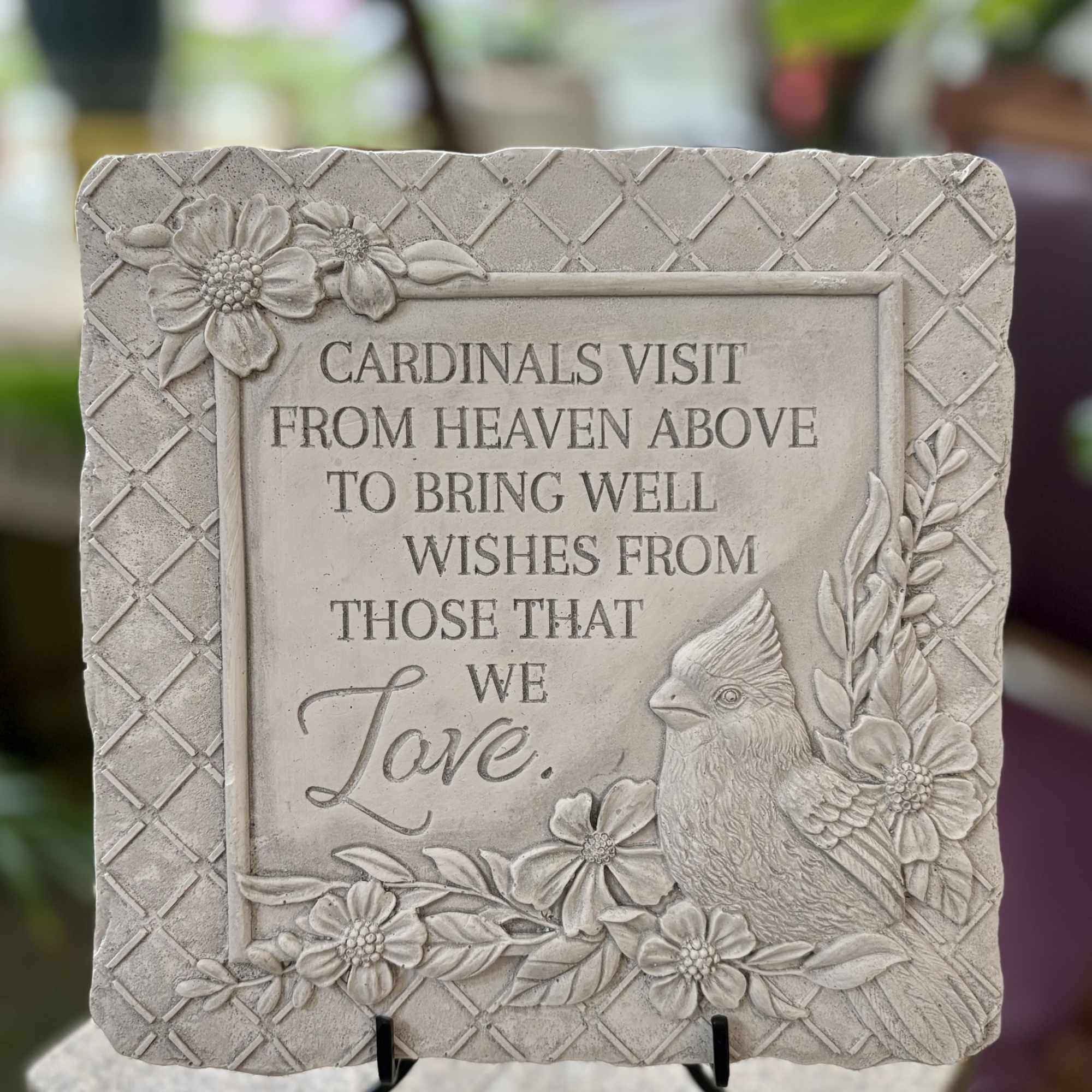 Square stepping stone that reads:
"Cardinals visit from heaven above to bring well