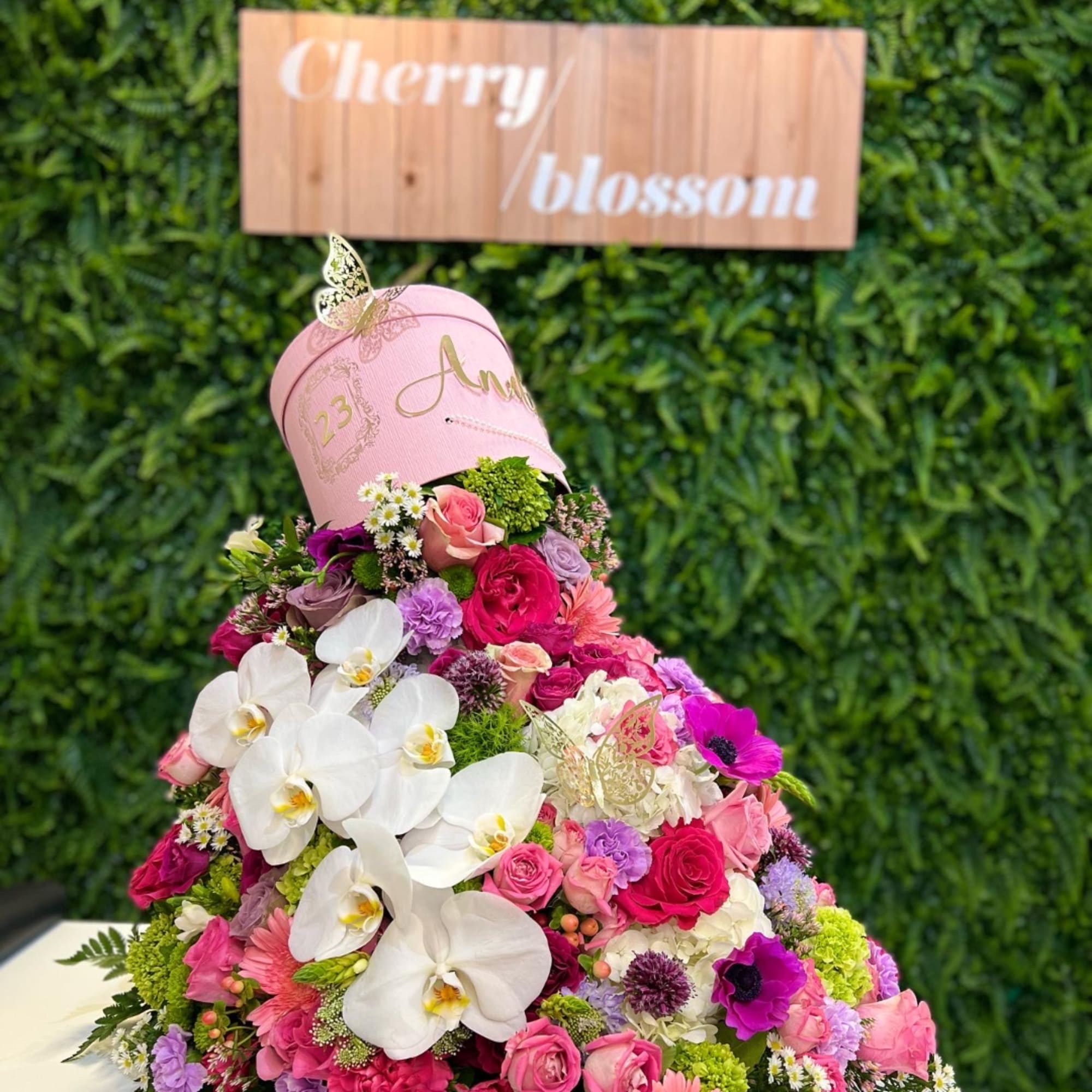 Pink hatbox arrangement with white orchids and mixed pink flowers, photo 4 of 6