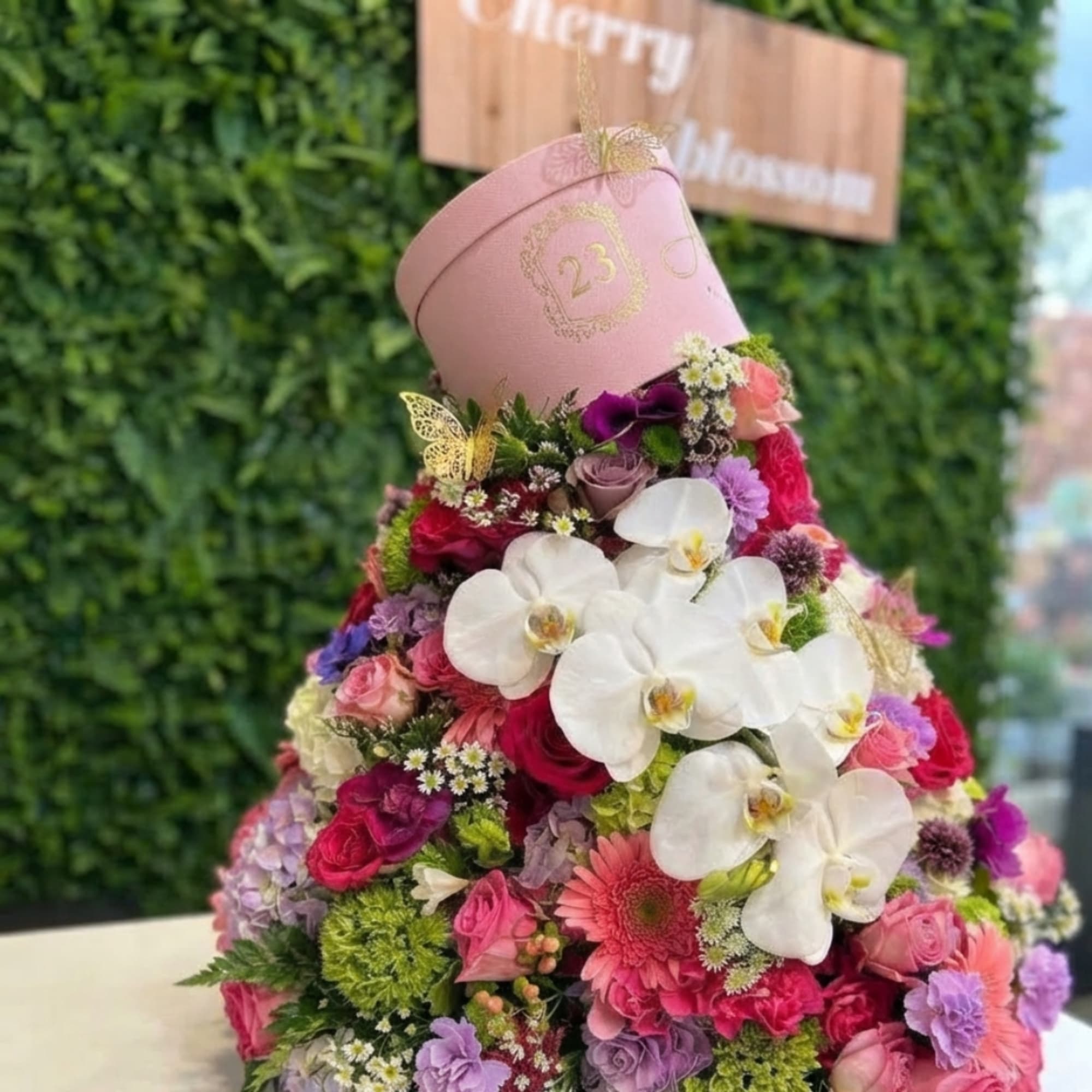Pink hatbox arrangement with white orchids and mixed pink flowers, photo 5 of 6