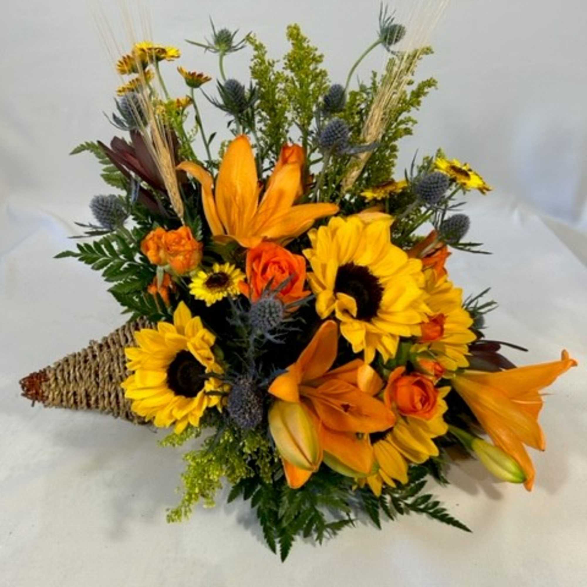 Orange and yellow mixed bouquet with sunflowers and lilies