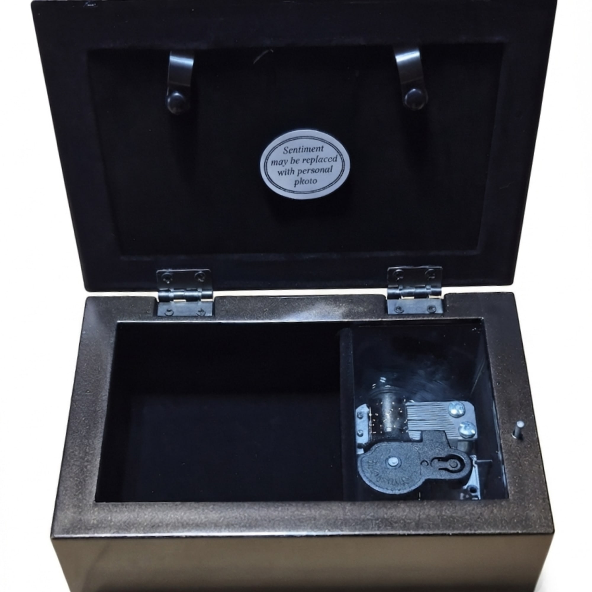 Black music box with an open lid and a small compartment inside