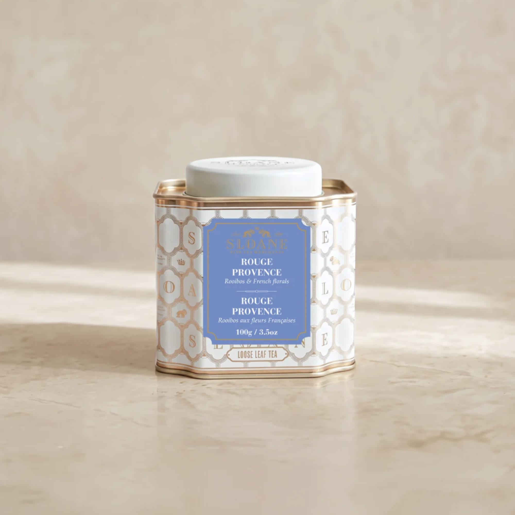 Decorative tin of loose leaf tea with a white lid